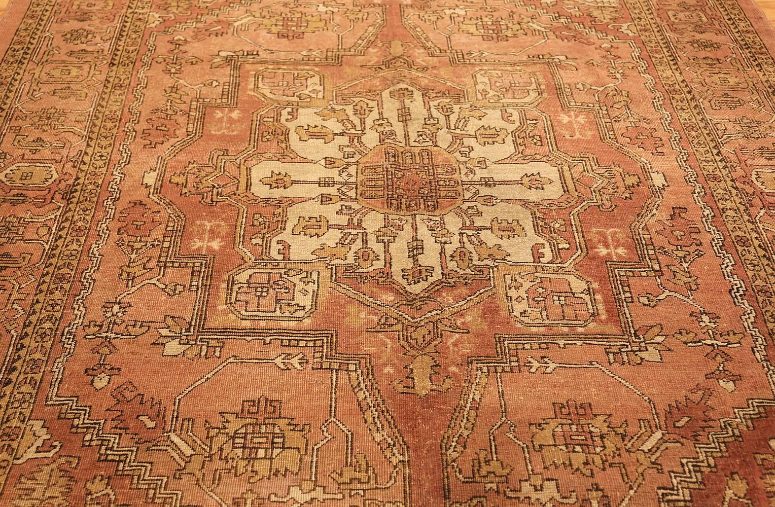 This majestic antique Oriental Agra carpet from India adapts the Classic Persian Heriz pattern with a large central medallion and corner pieces to a soft, cool, and palette with subtle effect.

Antique Amritsar rug, origin: India, circa:
