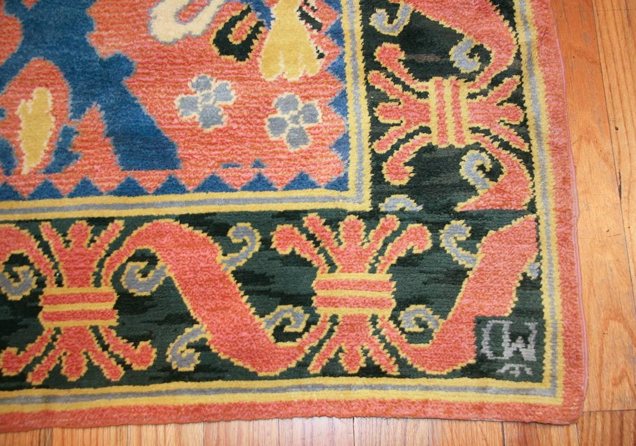 Beautiful and large vintage Spanish rug, Country of origin: Spain, date: circa 1930s. This vintage Spanish rug is rendered in a delightful, bright art deco style. The colorful pattern is crisply detailed and touched with light yellow line-work that