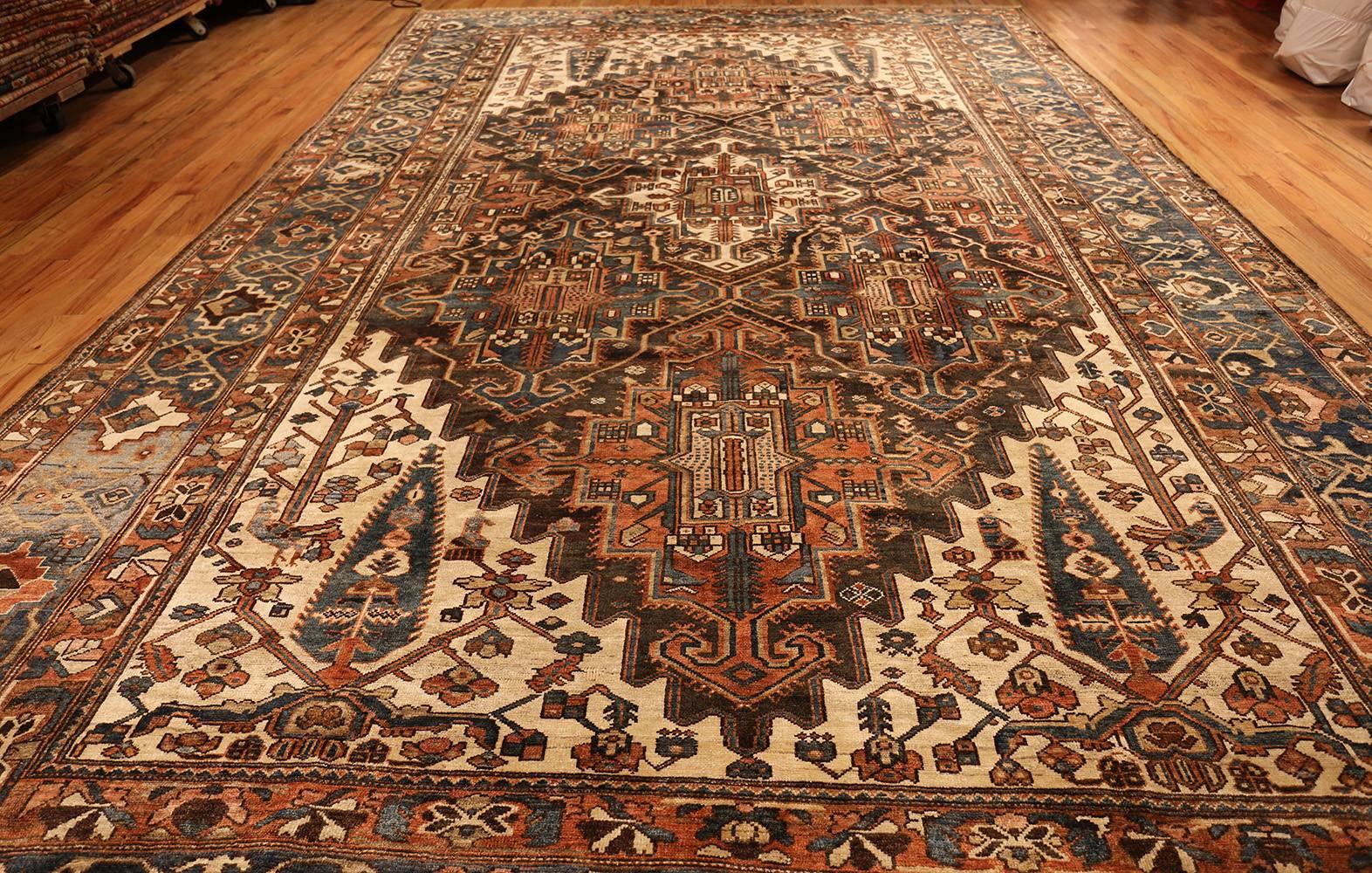 Large Antique Tribal Geometric Persian Bakhtiari Rug, Origin: Persia, Circa: 1920's. Size: 11 ft 4 in x 18 ft 8 in (3.45 m x 5.69 m)

Fiery influences abound in this visually stunning antique carpet from Persia and images of warm coals and embers