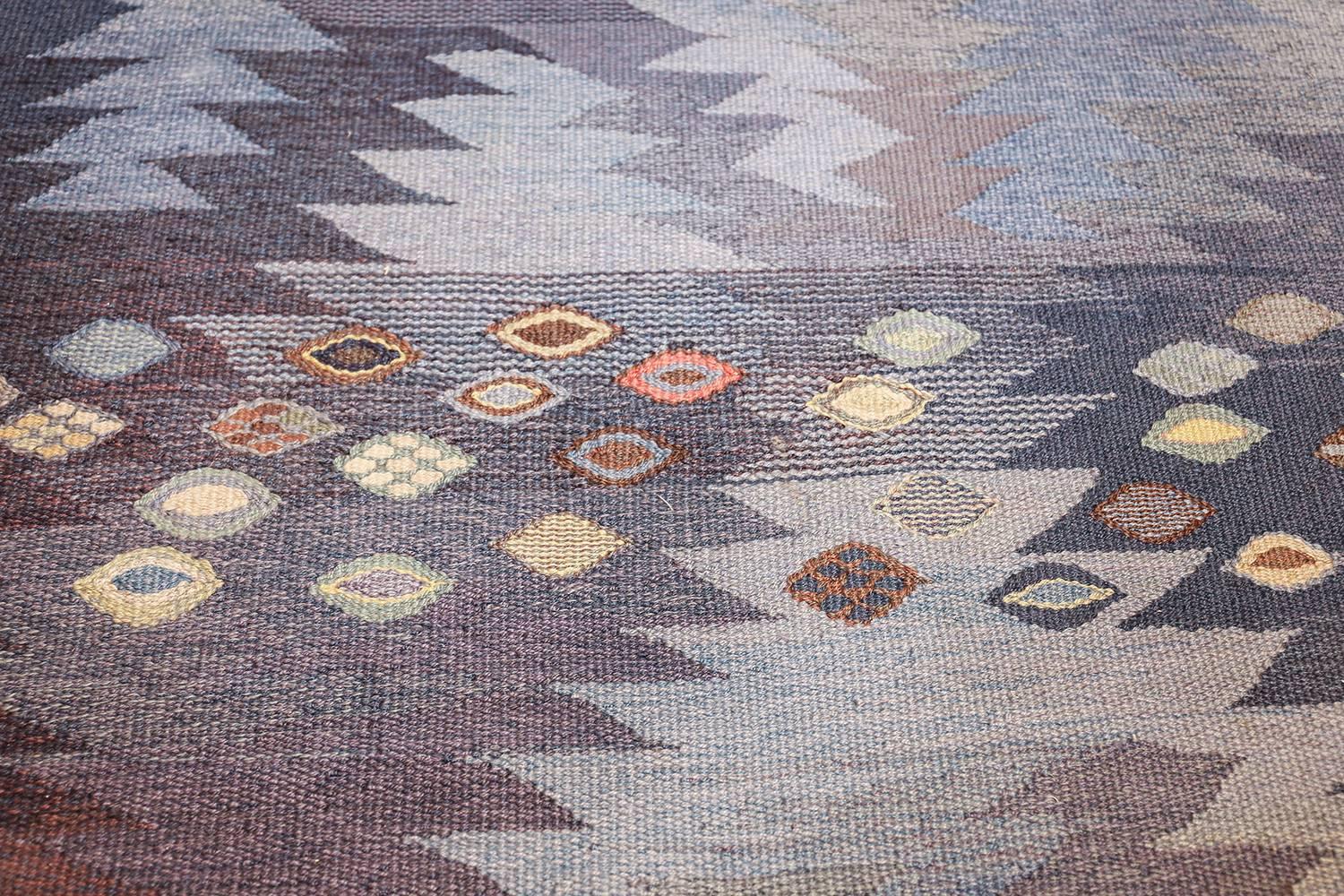 Breathtaking vintage Marta Maas Scandinavian Tanga rug by Barbro Nilsson, country of origin / Rug type: Scandinavia Rug, circa date mid–20th century. This stunning blue vintage Scandinavian Marta Maas rug by Barbro Nilsson features one of her most