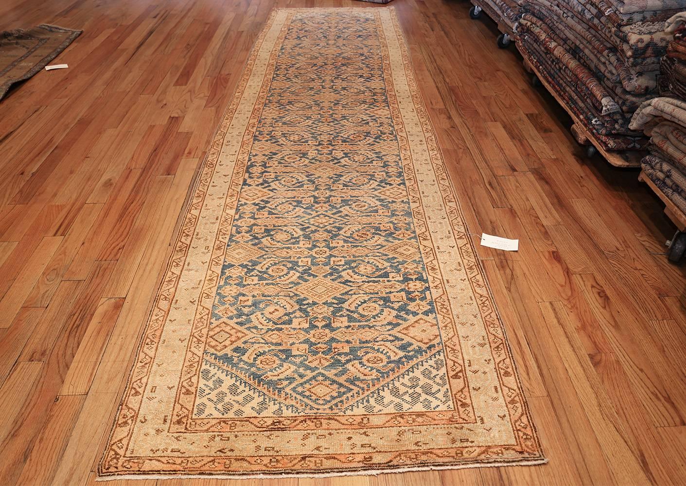Beautiful antique light blue Persian Malayer runner oriental rug, Country of Origin / Rug Type: Persian rugs, circa late 19th century, true to its traditional antique Persian Malayer rug roots, this vivacious antique Persian runner rug displays an