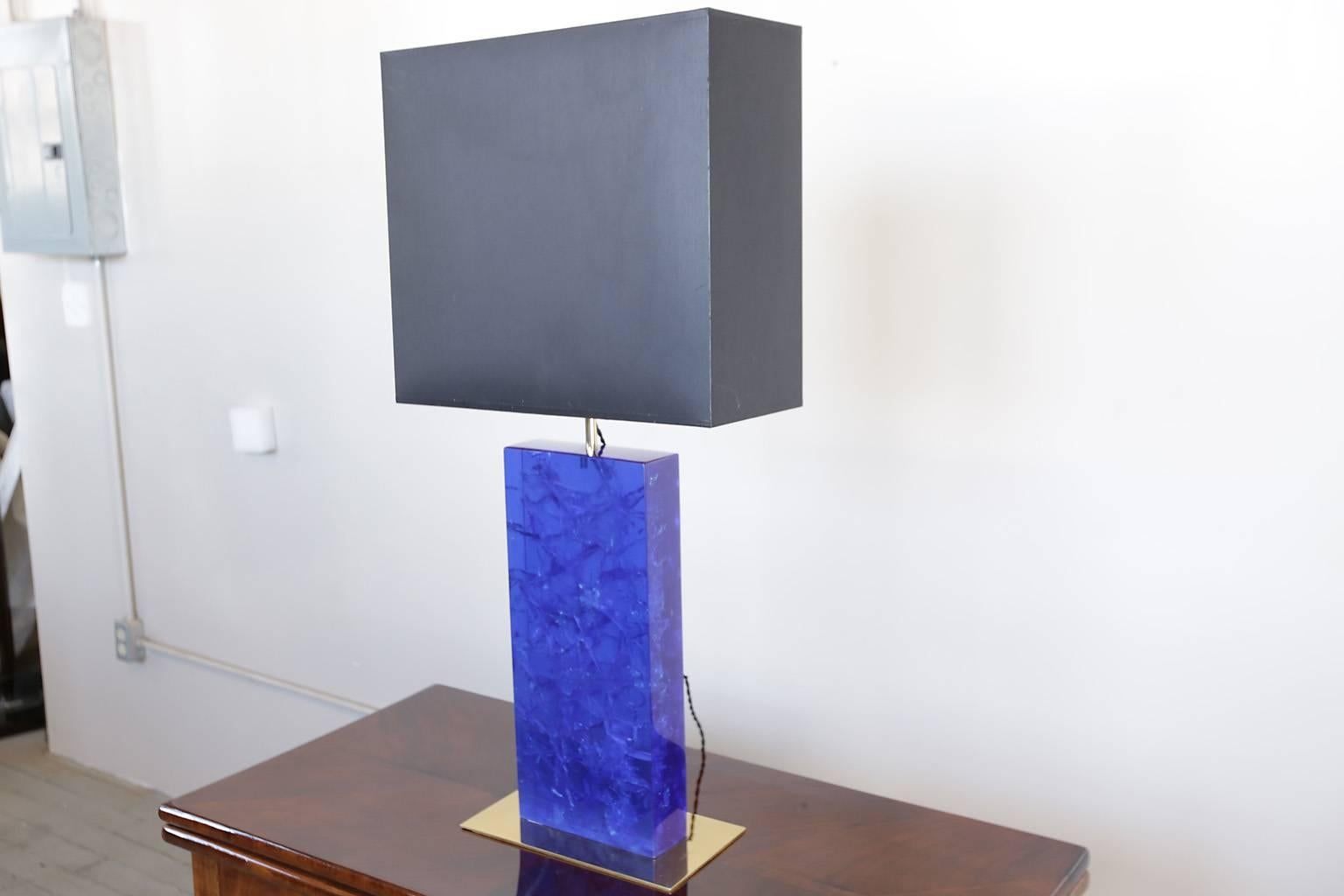 Mid-Century table lamp by Marie-Claude de Fouquieres. Crackled blue resin on brass base.
The lamp shade is 17.5inch wide x 7inch deep.
The base of the lamp is 12inch wide x 7inch deep.
The blue resin by itself is 8inch wide x 3inch deep.