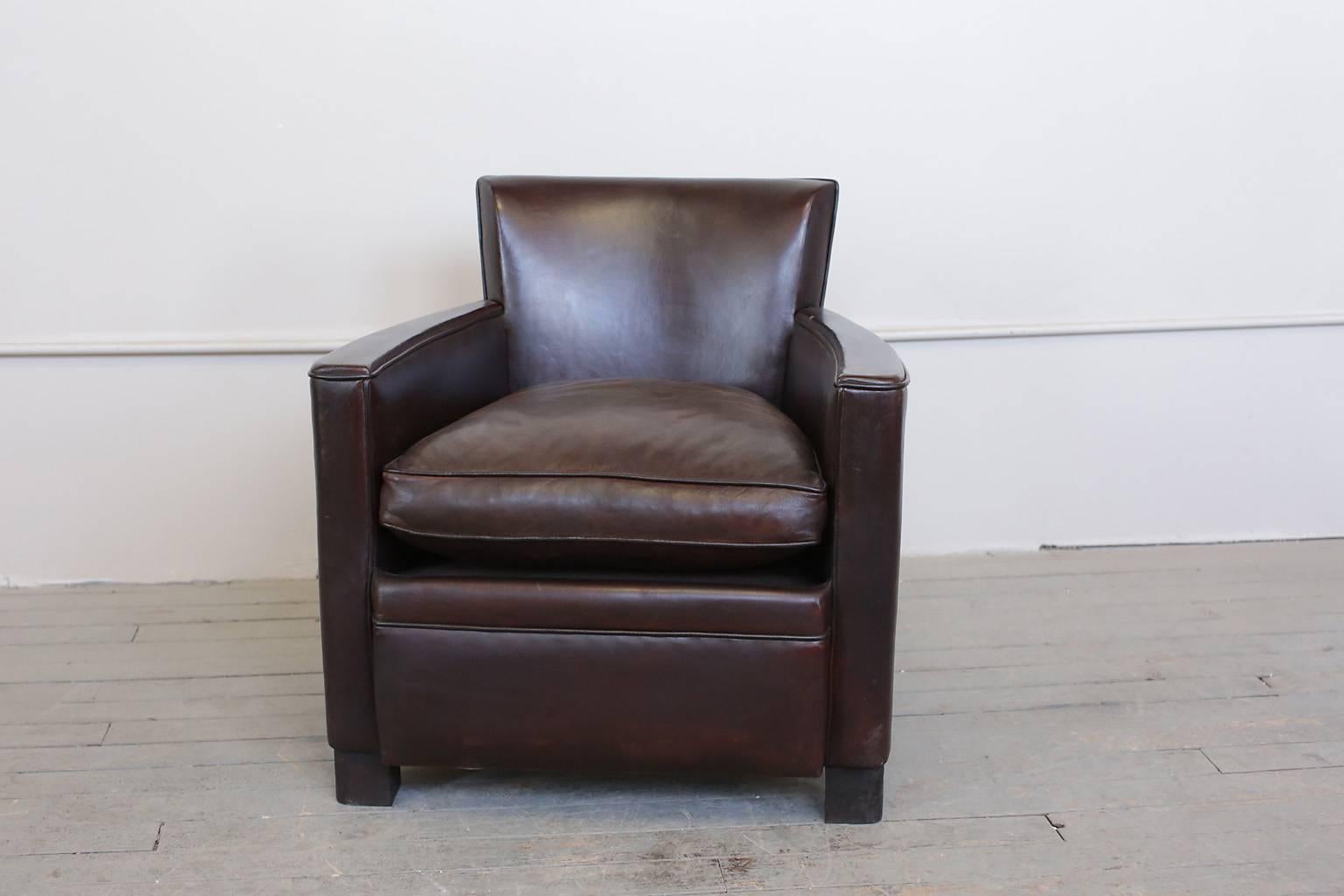 French Art Deco club chairs. Original dark brown leather upholstery. Excellent condition. In the manner of Dominique.