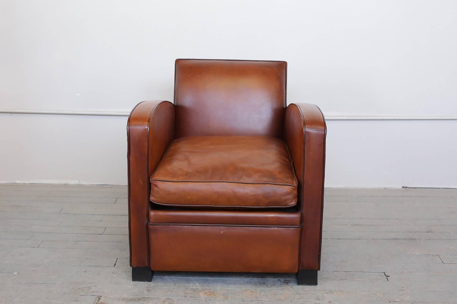 French Art Deco Parisian club chairs with their original leather are in excellent condition.