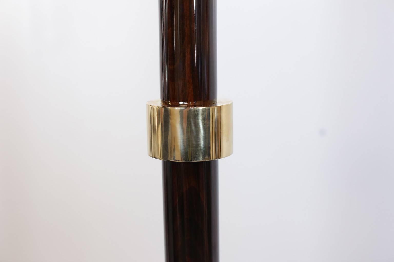  French Art Deco torchiere/floor lamp.. Lacquered wood with brass band details and brass bowl.