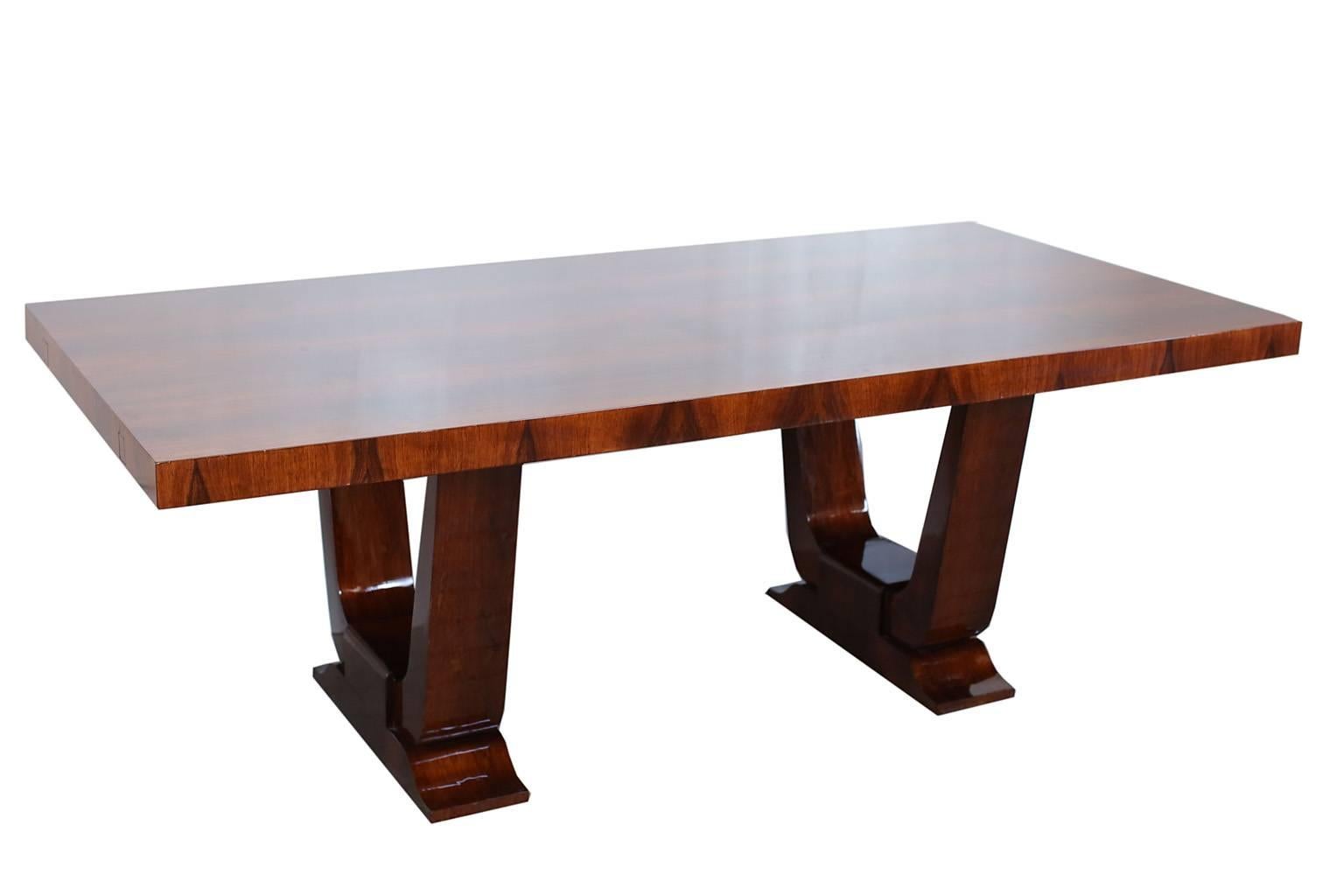 French Art Deco walnut dining table. Includes two tablecloth extensions. Extensions are 20 inches each.