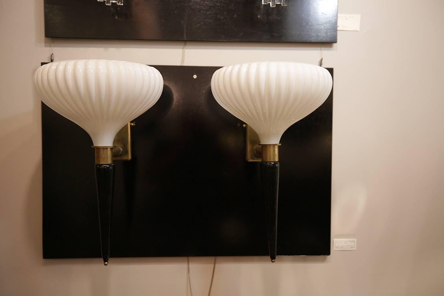 Pair of Art Deco Murano black and white glass sconces with bronze hardware.
