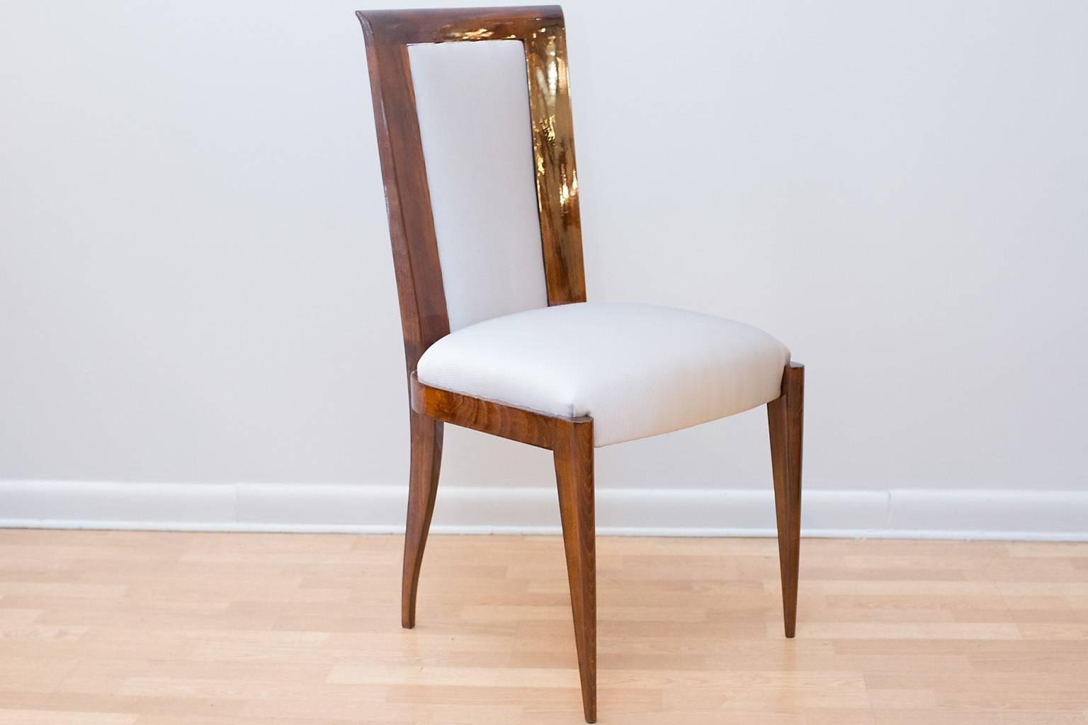French Art Deco dining chairs with upholstered seat and backs.