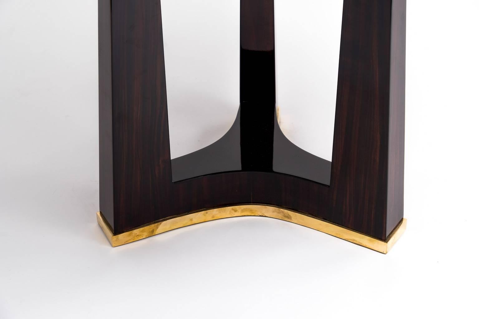 Elegant French Art Deco center table. Macassar ebony sunburst. Marquetry top with bronze details.