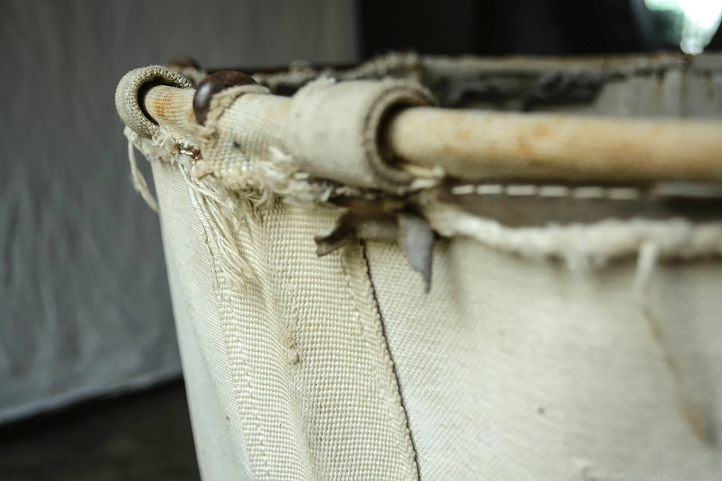 Vintage canvas laundry bag on frame. 