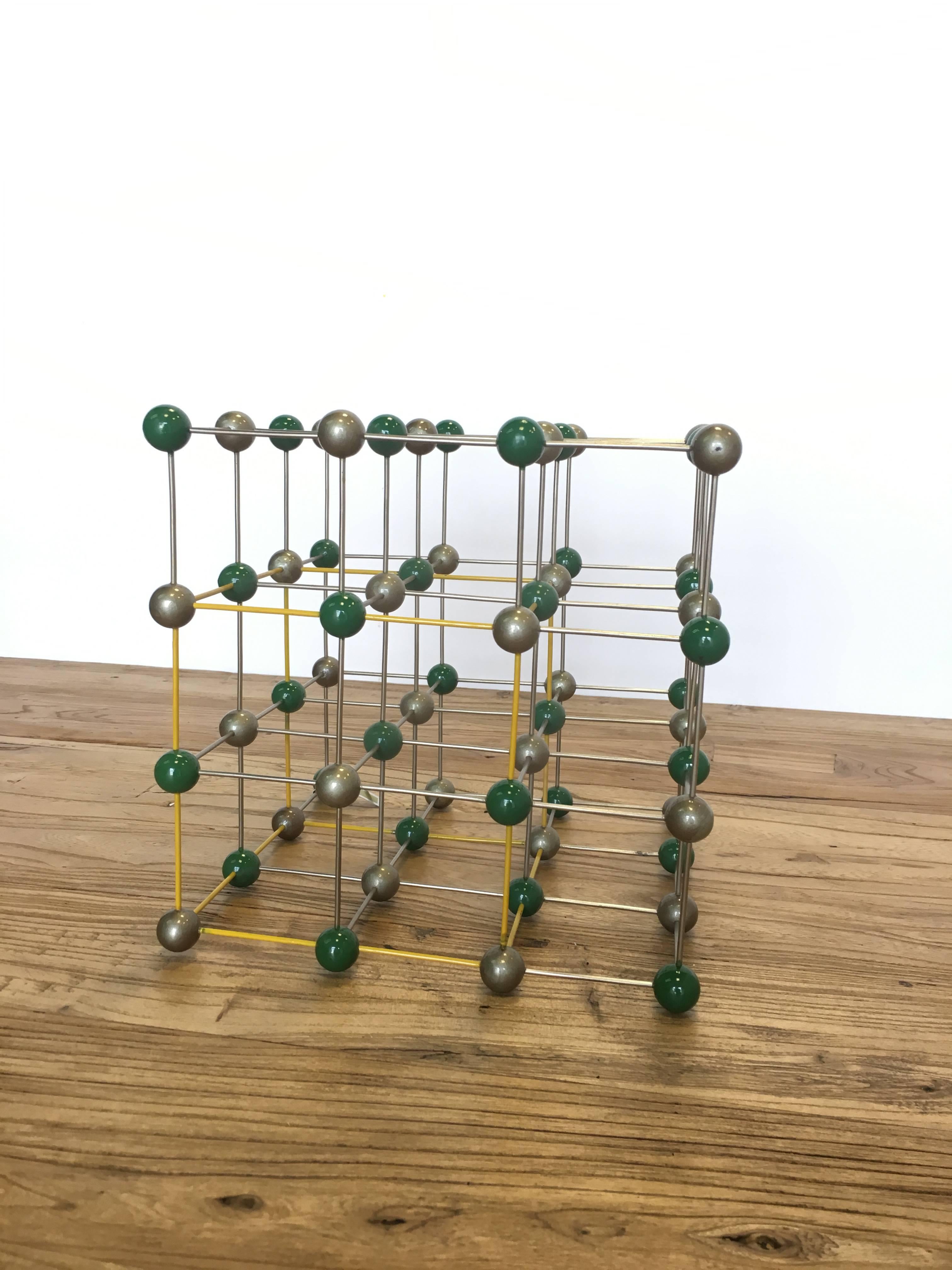 Vintage ball and stick molecular model depicting elemental structure of NaCl, salt, circa 1950s.