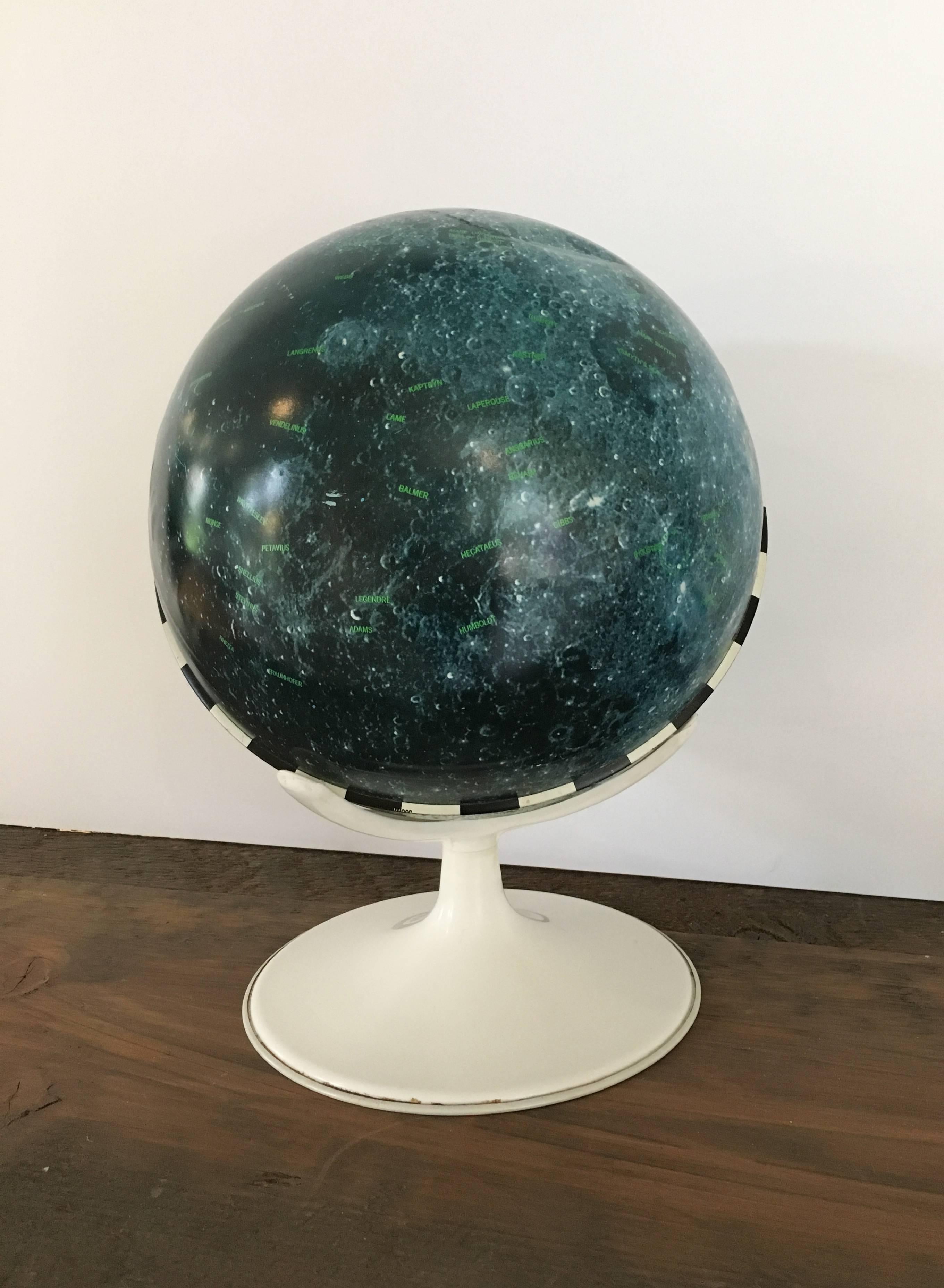 J. Chein & Company Lunar Globe, 1969. Dates prior to Apollo 11's first manned-moon landing. Maps the geography of the moon as well as attempts to explore the surface. 

Tin globe in great condition; one dent towards the top. Please see images or