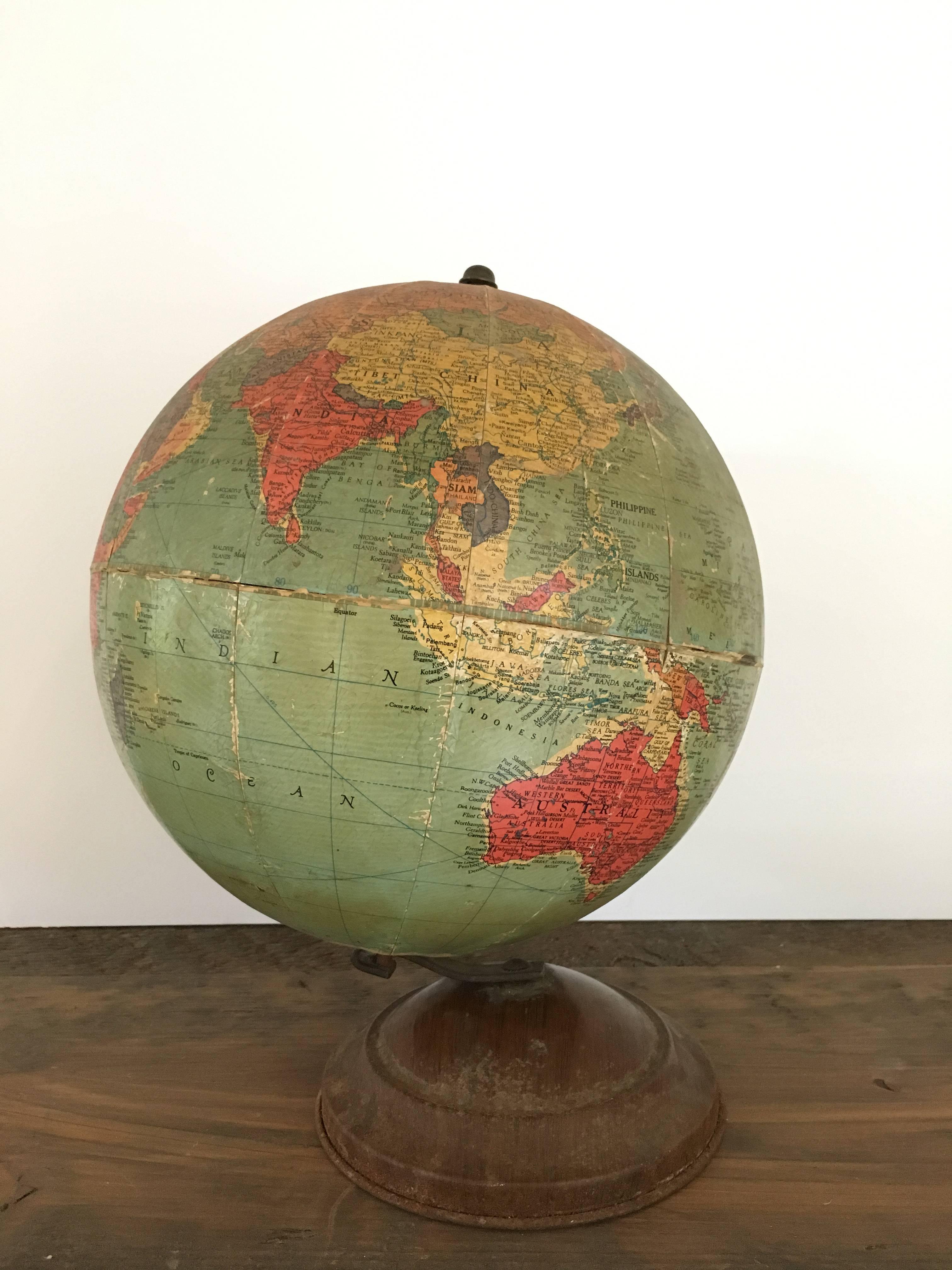 Gorgeous antique Replogle globe, handmade, circa 1940, on metal base.

Incredible patina; please review images and inquire for additional condition details.