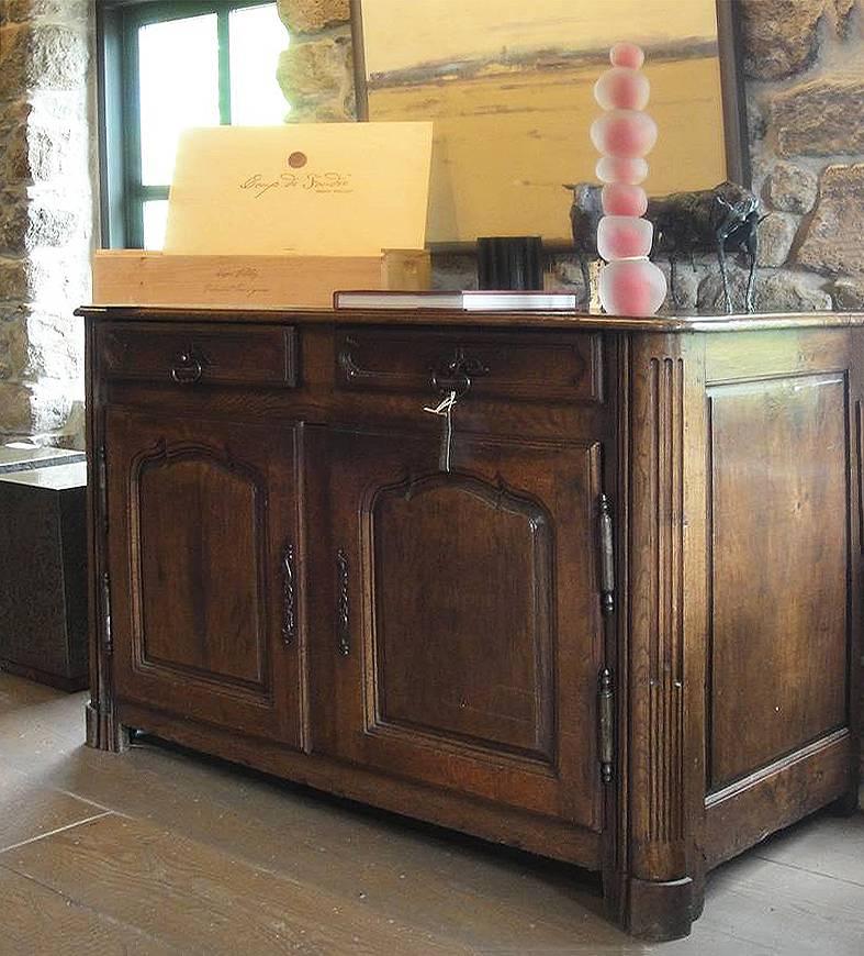 Vintage late 17th century oak buffet with hand-forged metal hardware. 

Two drawers and two doors, with carved detailing.

  
