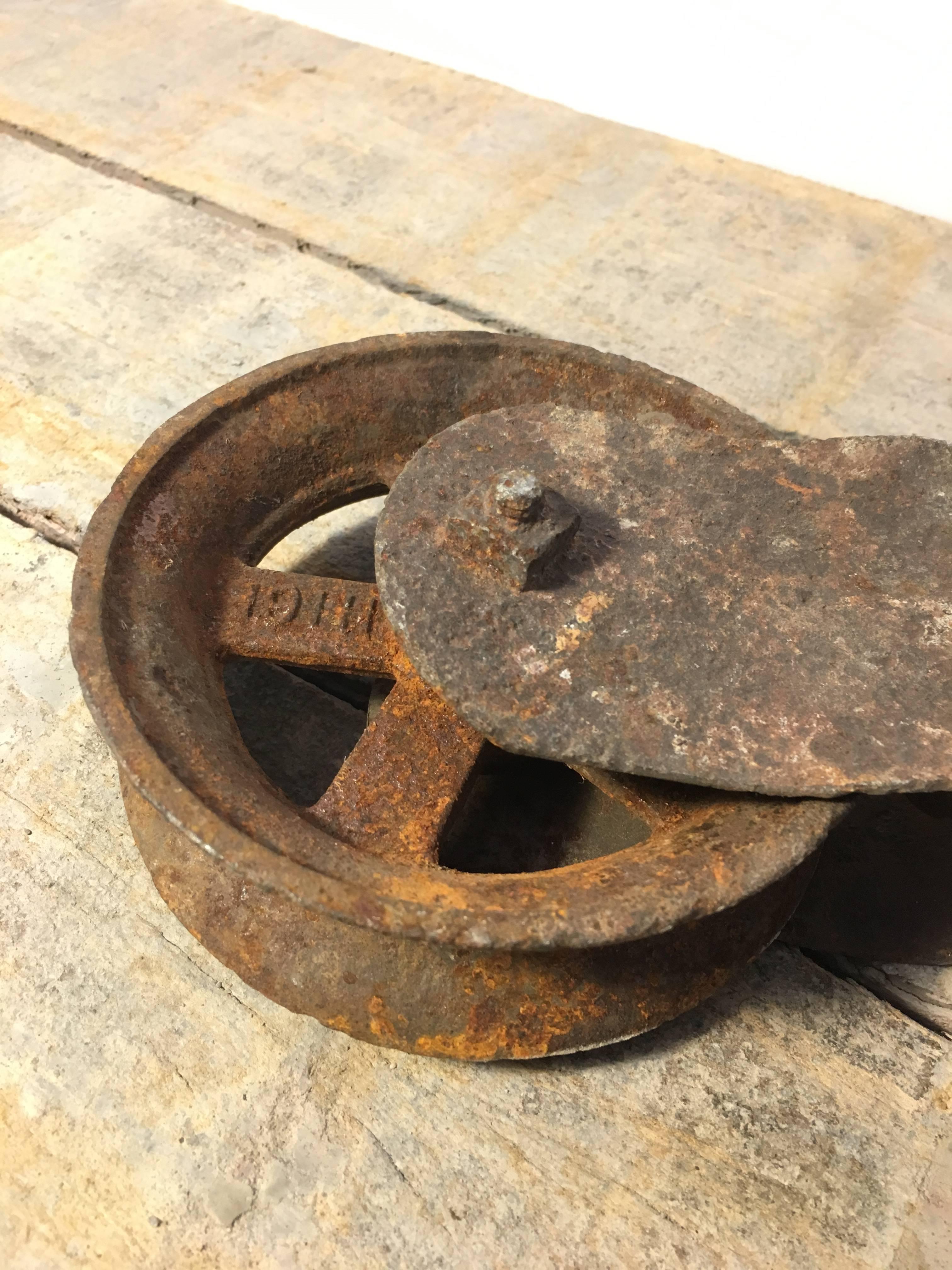 antique metal pulley