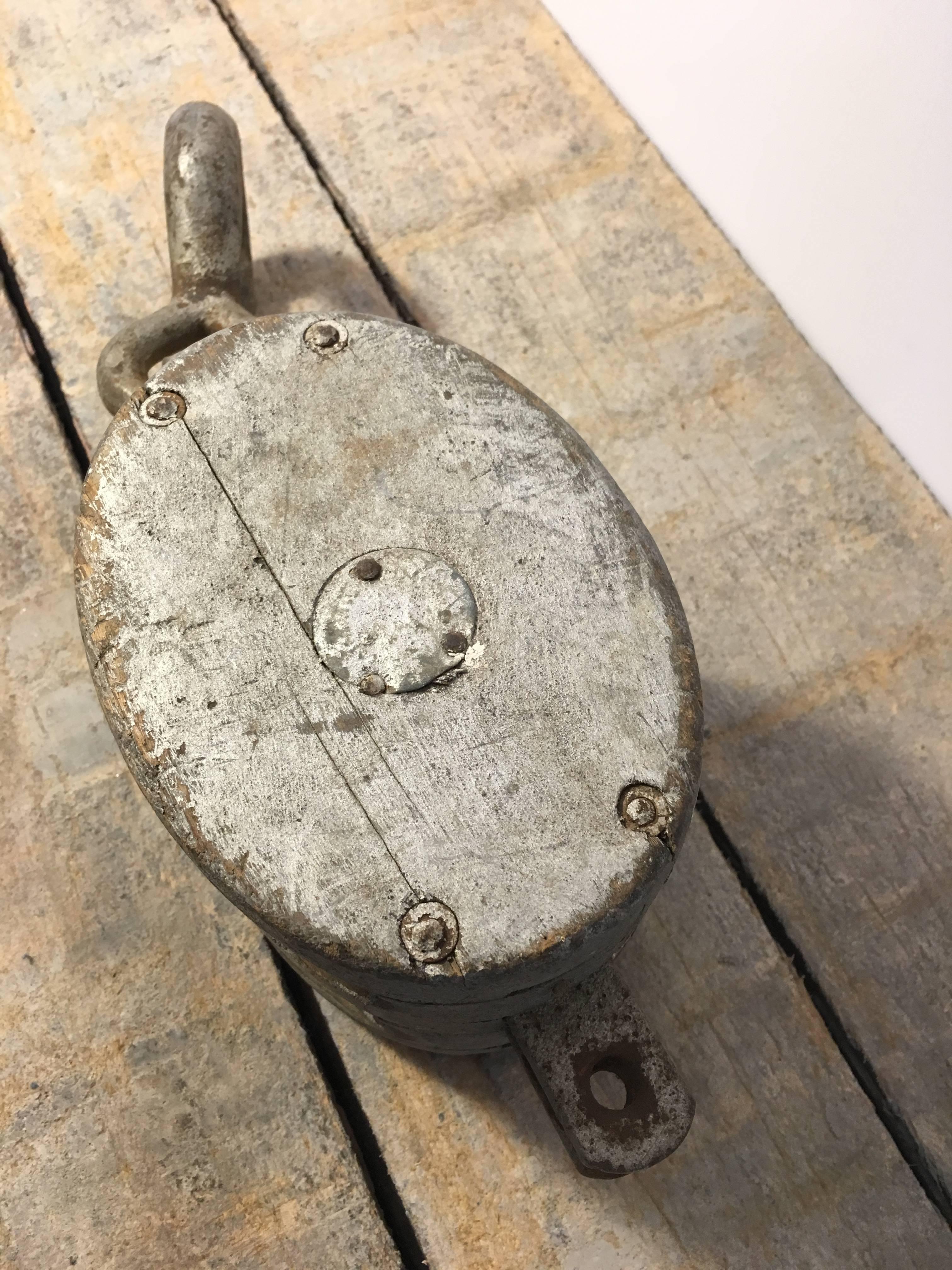 Vintage painted wood double block pulley. Silver-grey paint and nearly hidden metal star decal on the side. 