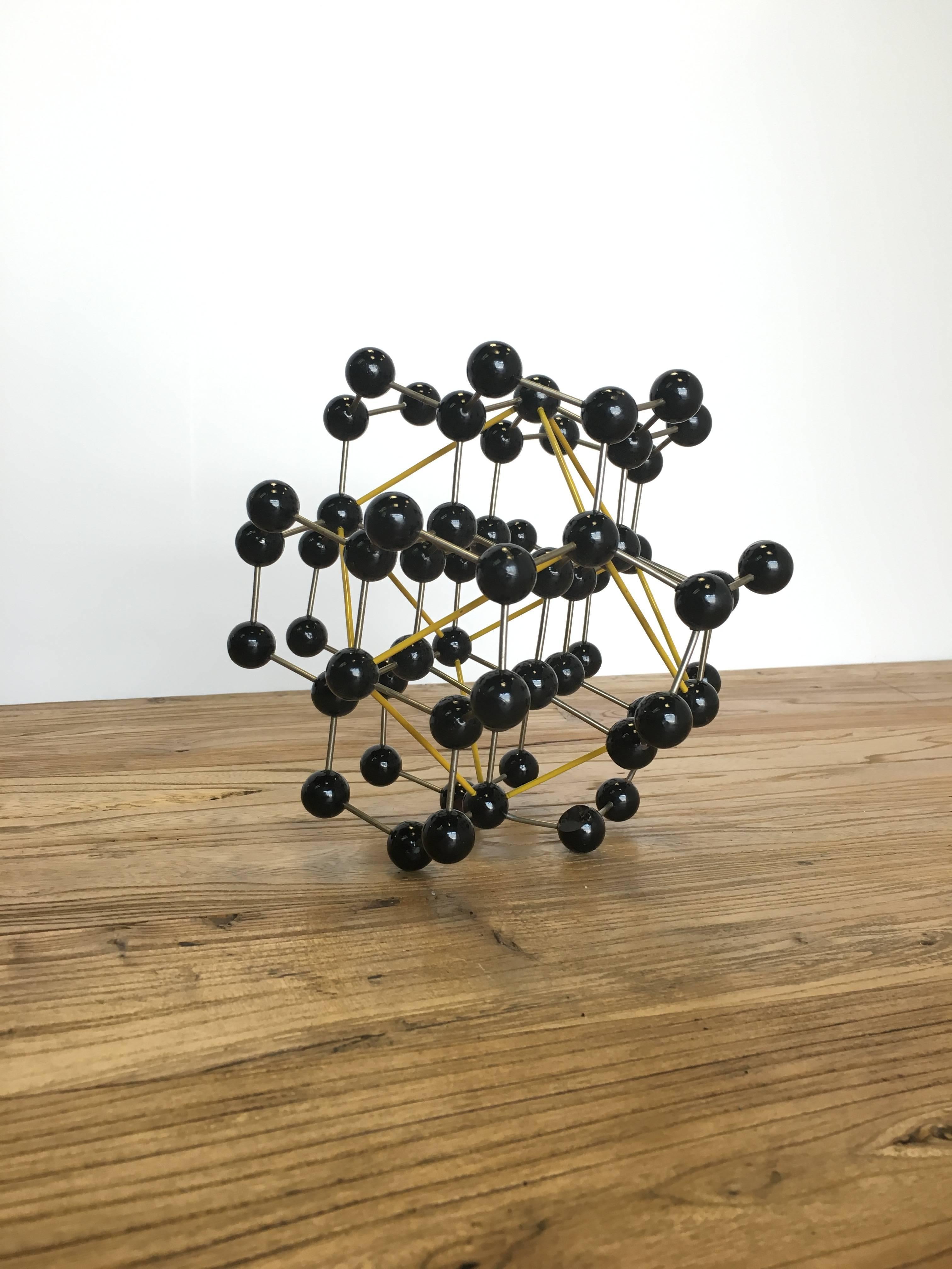 Vintage ball and stick molecular model depicting elemental structure of diamond, circa 1950s.