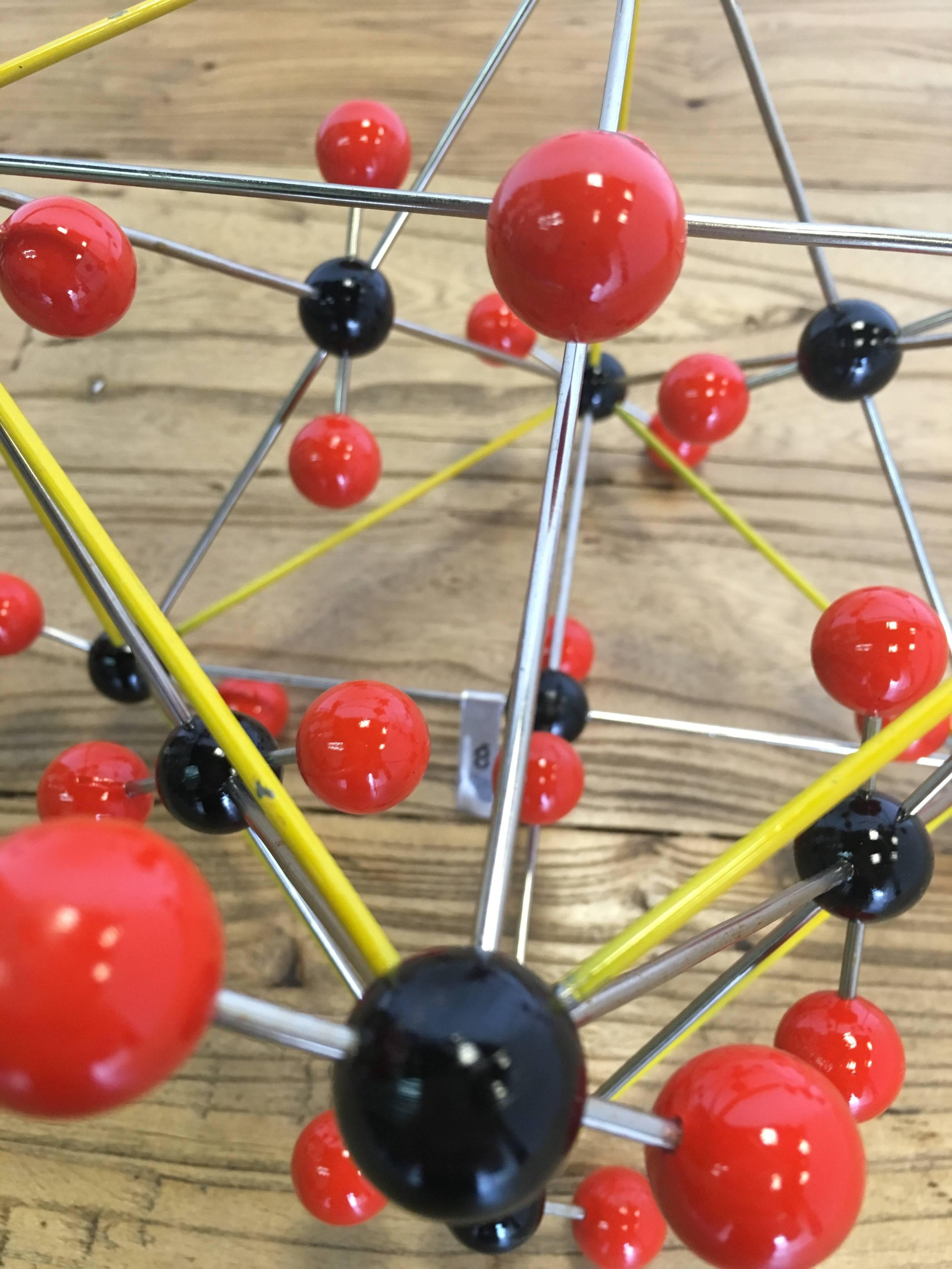 Vintage ball and stick molecular model depicting elemental structure of carbon dioxide, circa 1950s.
