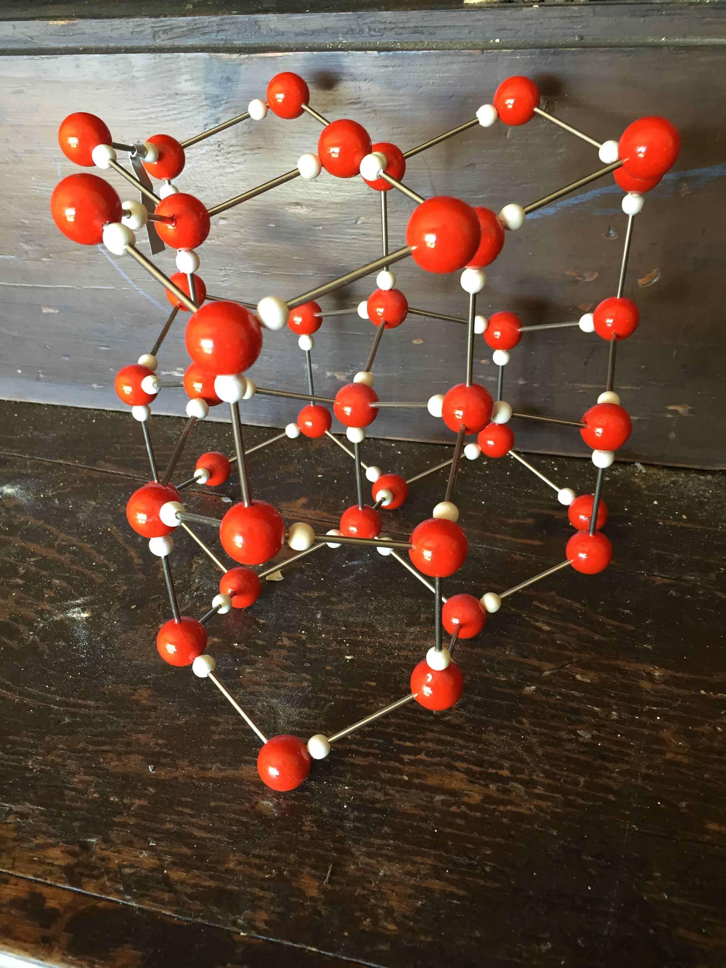 Vintage ball and stick molecular model depicting elemental structure of solid H20, ice, circa 1950s.