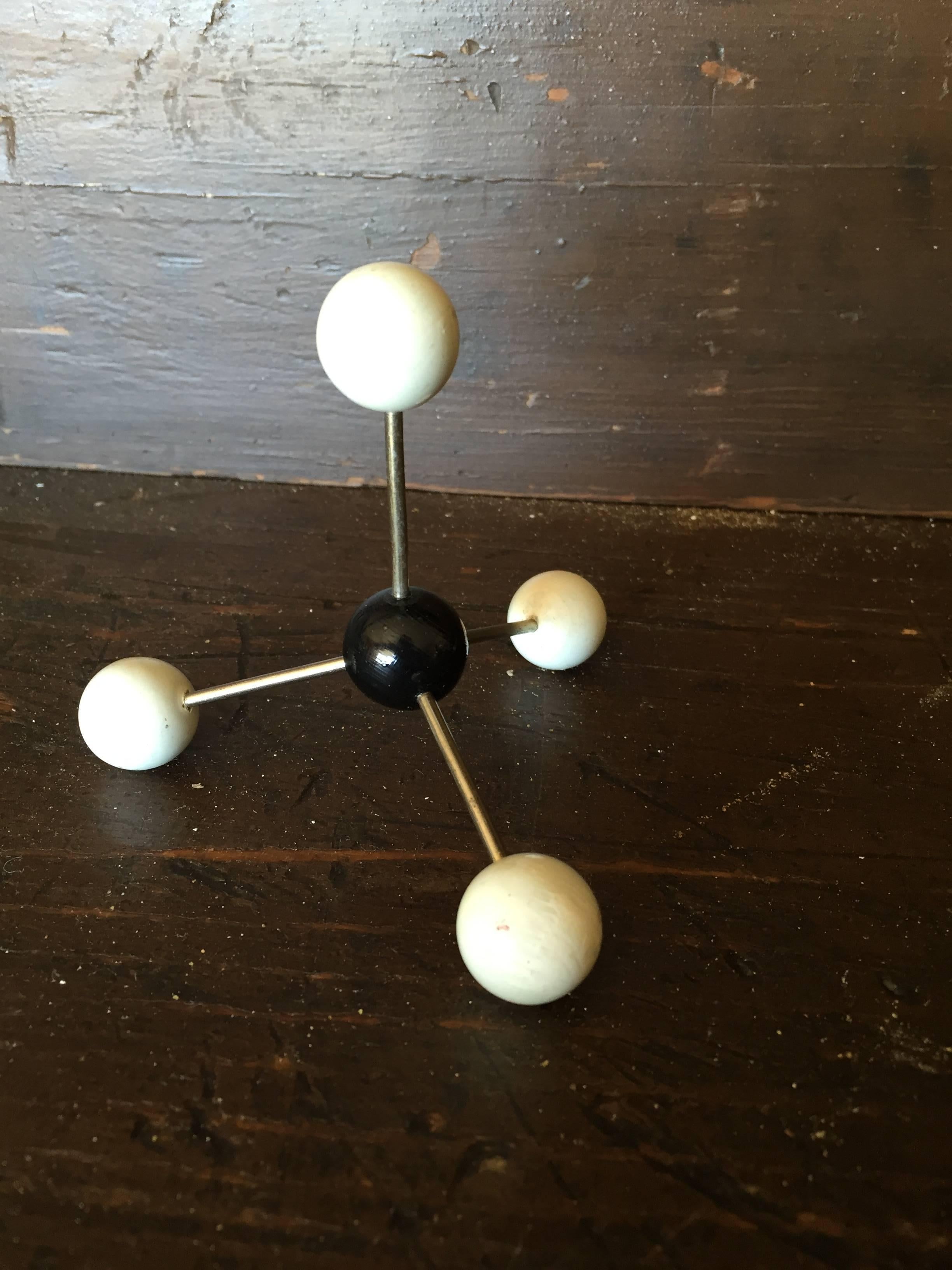 Vintage ball and stick molecular model depicting elemental structure of methane, circa 1950s.