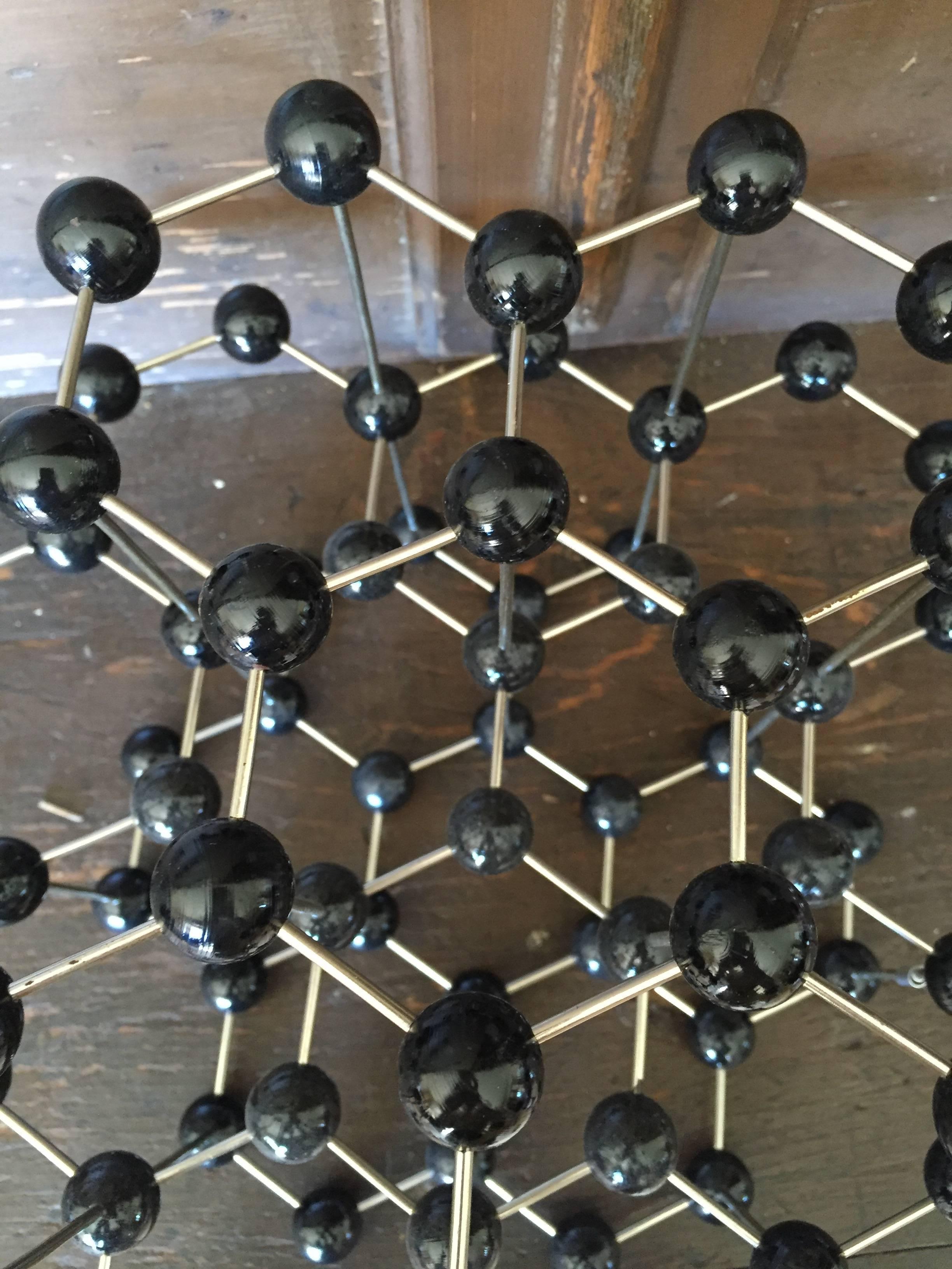 Vintage ball and stick molecular model depicting elemental structure of graphite, circa 1950s.