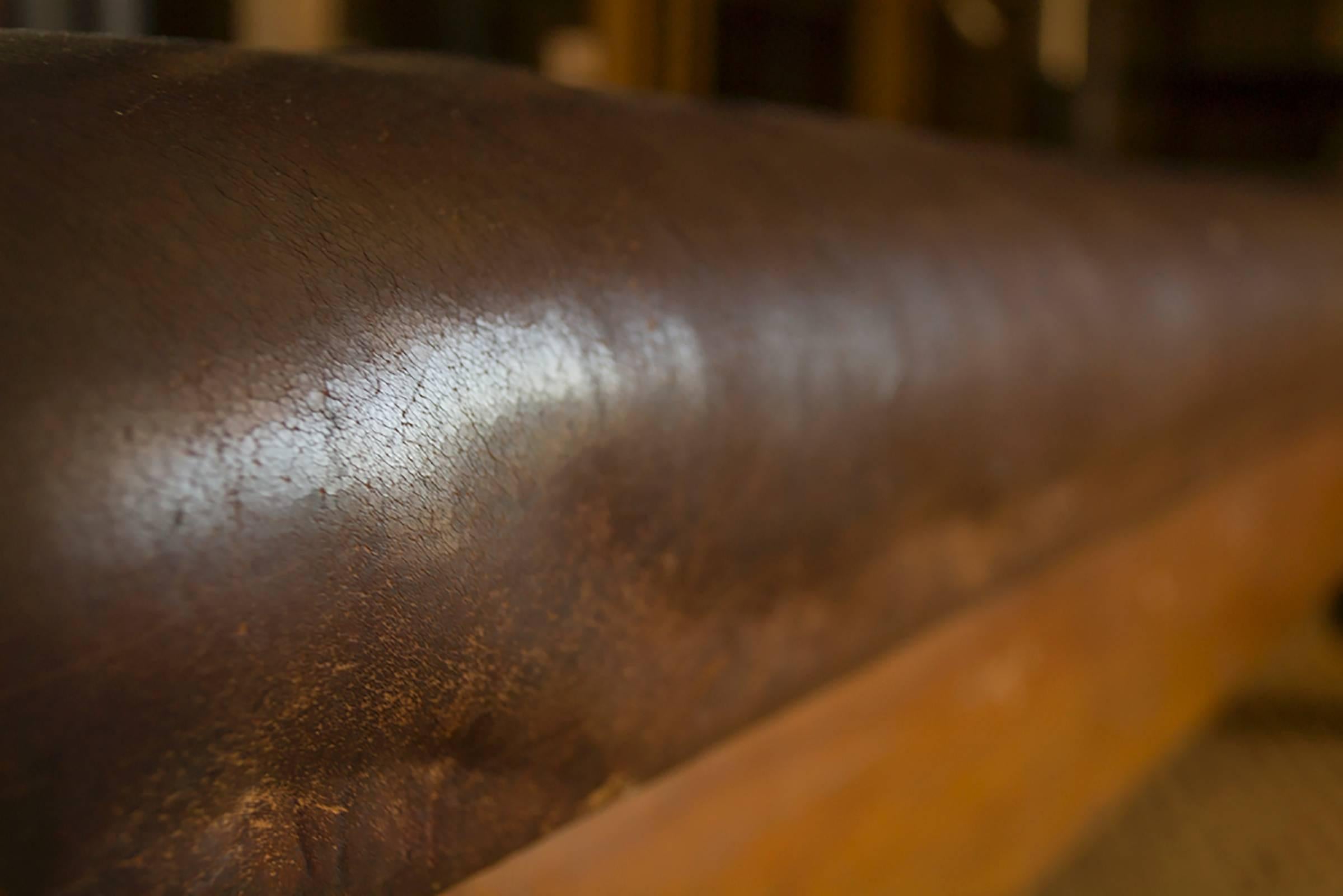 Large wood and leather gym bench.