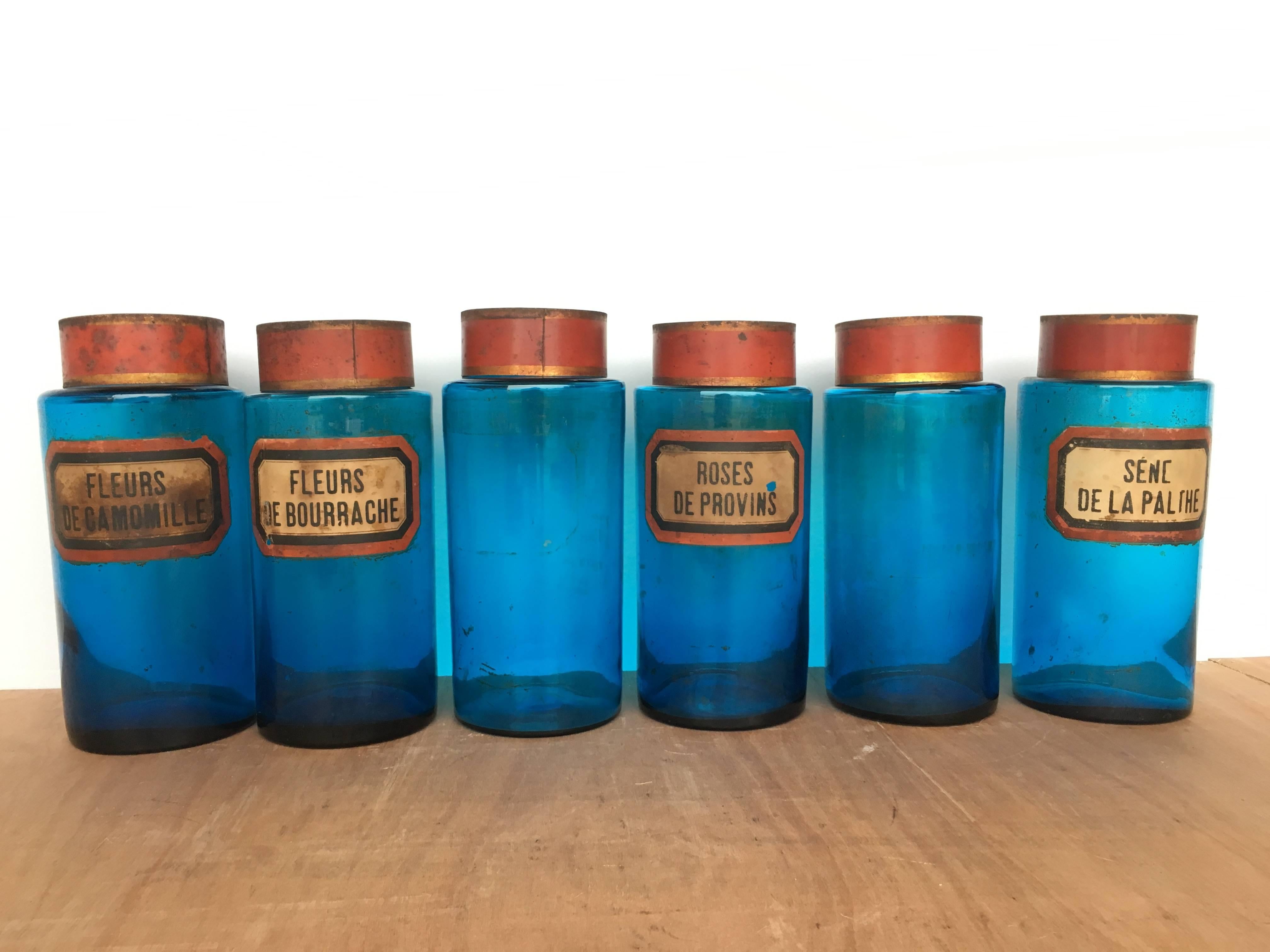 Vintage French apothecary jars. Blue glass is a cerulean color. Late 19th century or early 20th century. 

Priced for set of six; please inquire regarding availability of individual jars. 