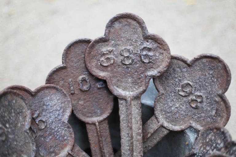 Set of Four Cast Iron Quatrefoil Numbered Grave Markers, 19th Century