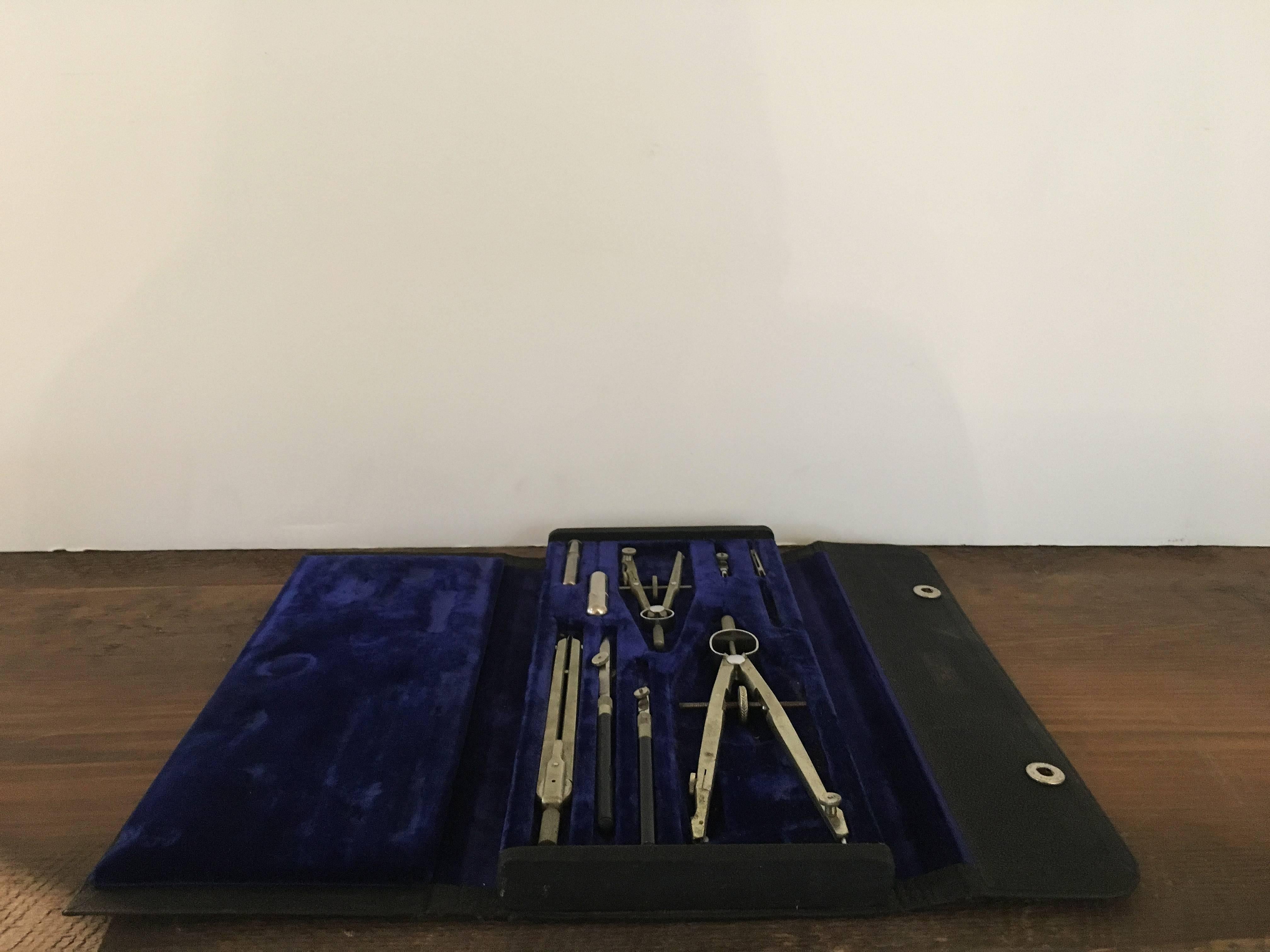 Vintage drafting tool kit with blue velvet interior.

Snaps closed; from Keuffel and Esser, the first American company in US to specialize in drafting and drawing tools, founded in 1867, based in New York.