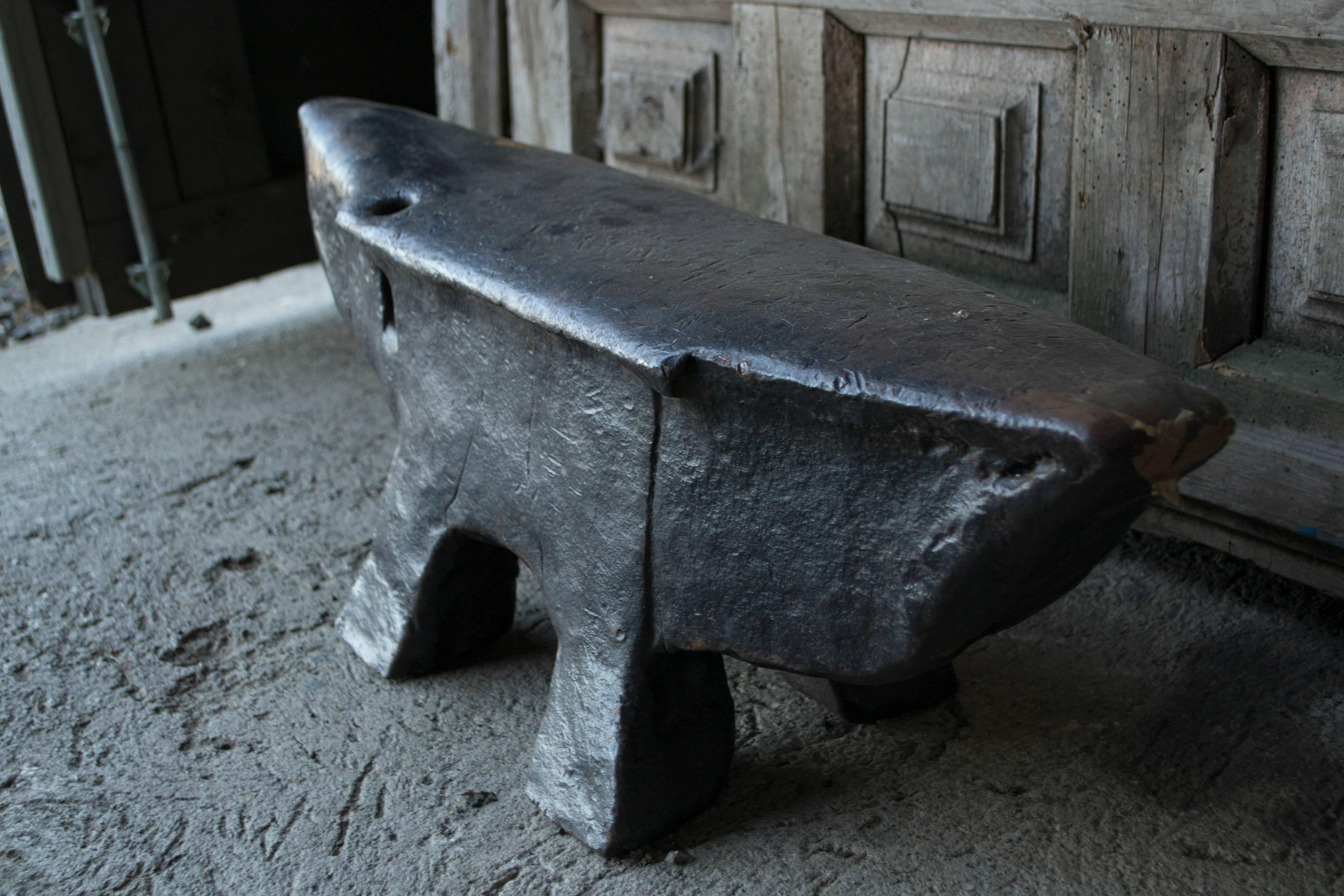 Vintage French, iron and hand forged blacksmith's 'pig' anvil with a beautifully aged texture and patina. A sculptural piece with historic symbolism and substantial weight.
 