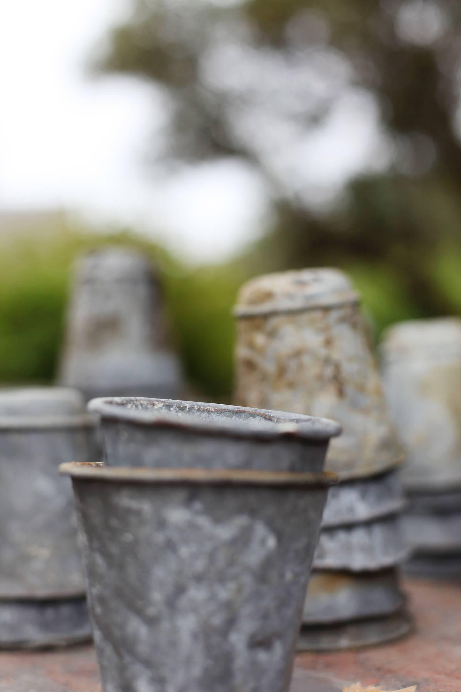 Vintage English zinc pots; perfect for succulents, organization, or outdoor garden treasures. 

Priced and sold as sets of four, selected at random from available pots. Please inquire for specific or additional availability. 

