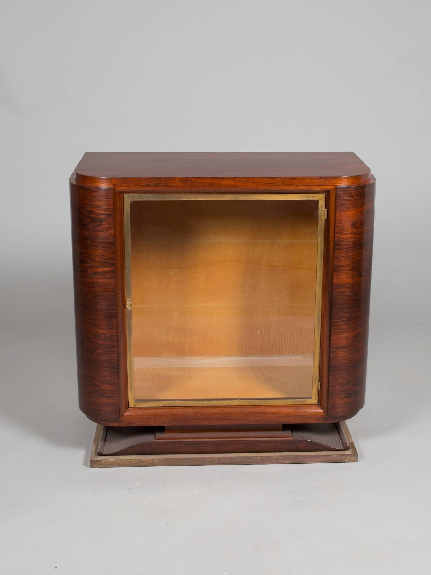 Chic Art Deco glass door cabinet with brass detailing. Glass shelves to be provided if desired.