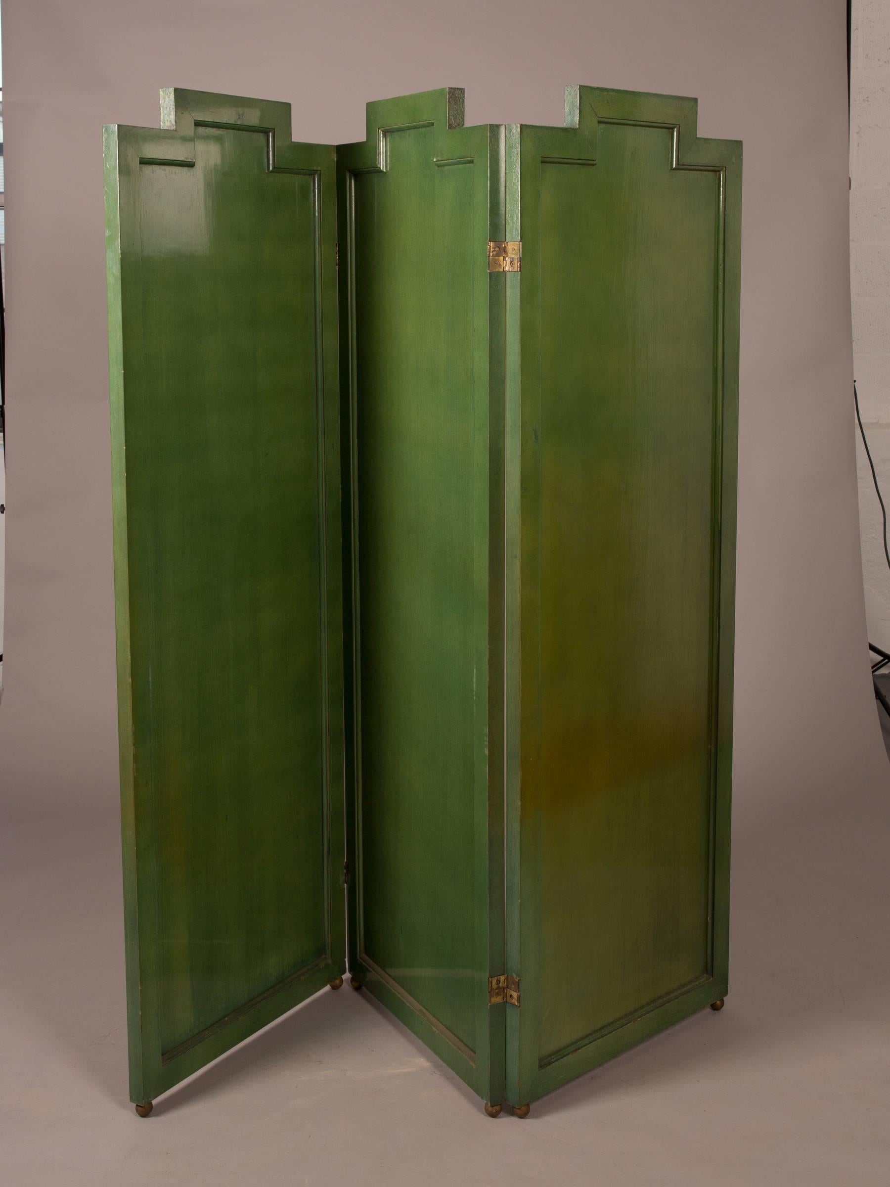 Fabulous green lacquered three panel Art Deco folding screen with decorative brass and copper inlaid design and brass hinges. Each panel measures 25.5