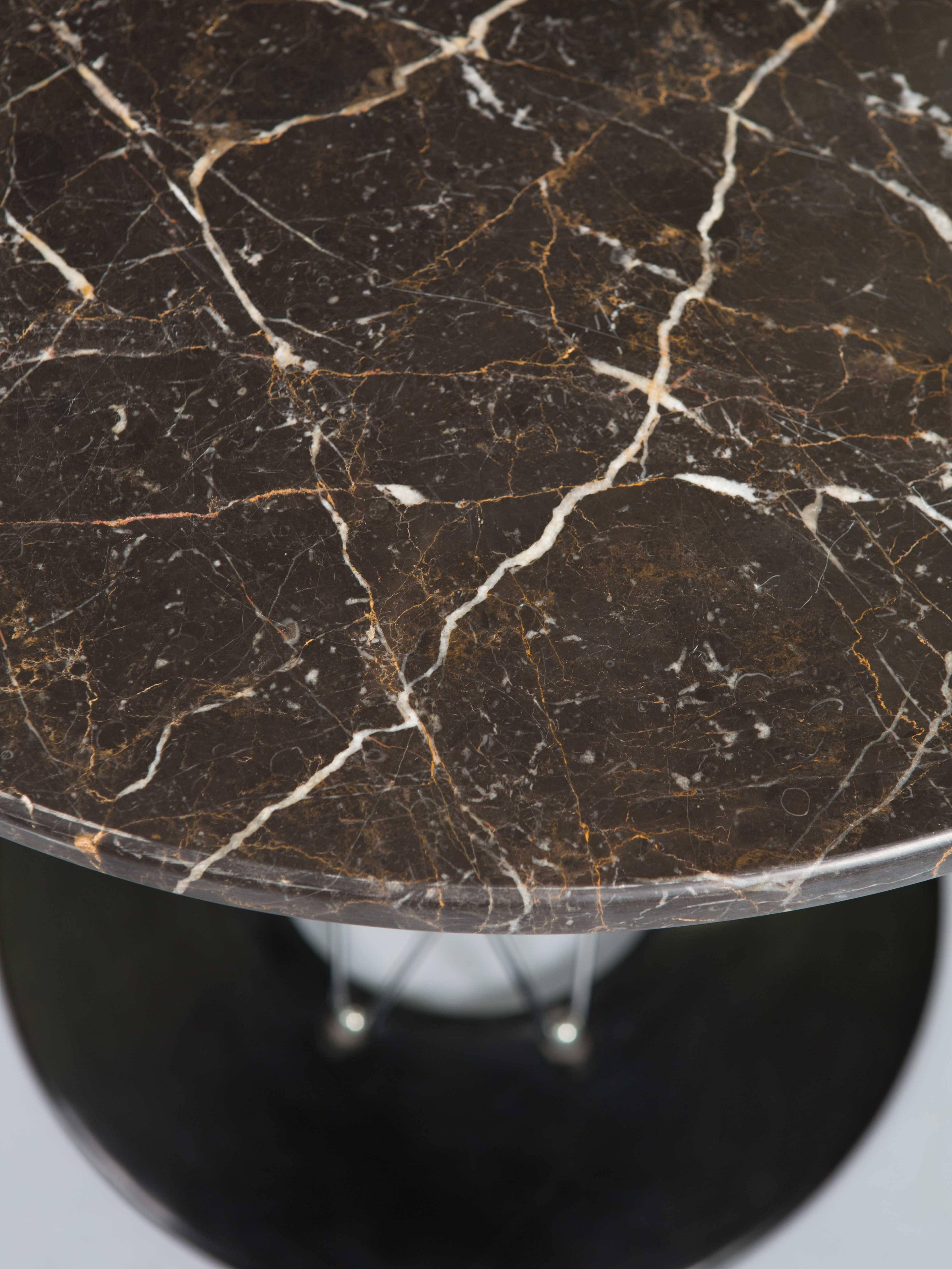 Isamu Noguchi cyclone table with custom black marble top.
Base measures 20