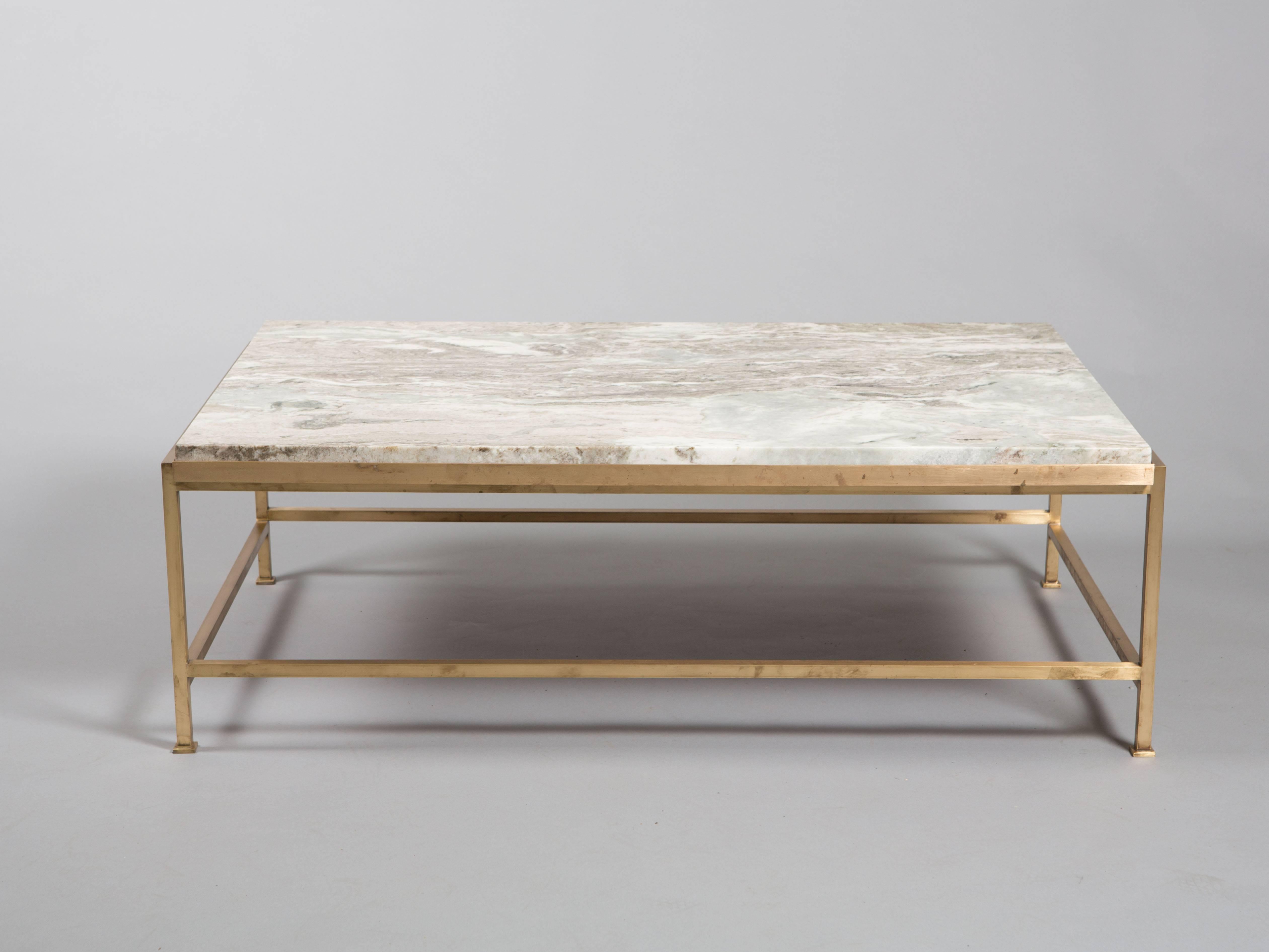Paul McCobb brass coffee table produced for a residence in Connecticut. Cracked original top upgraded with a substantial piece of cut marble. Amazing custom size that isn't easily found. Re-polished base with some oxidation showing just the right