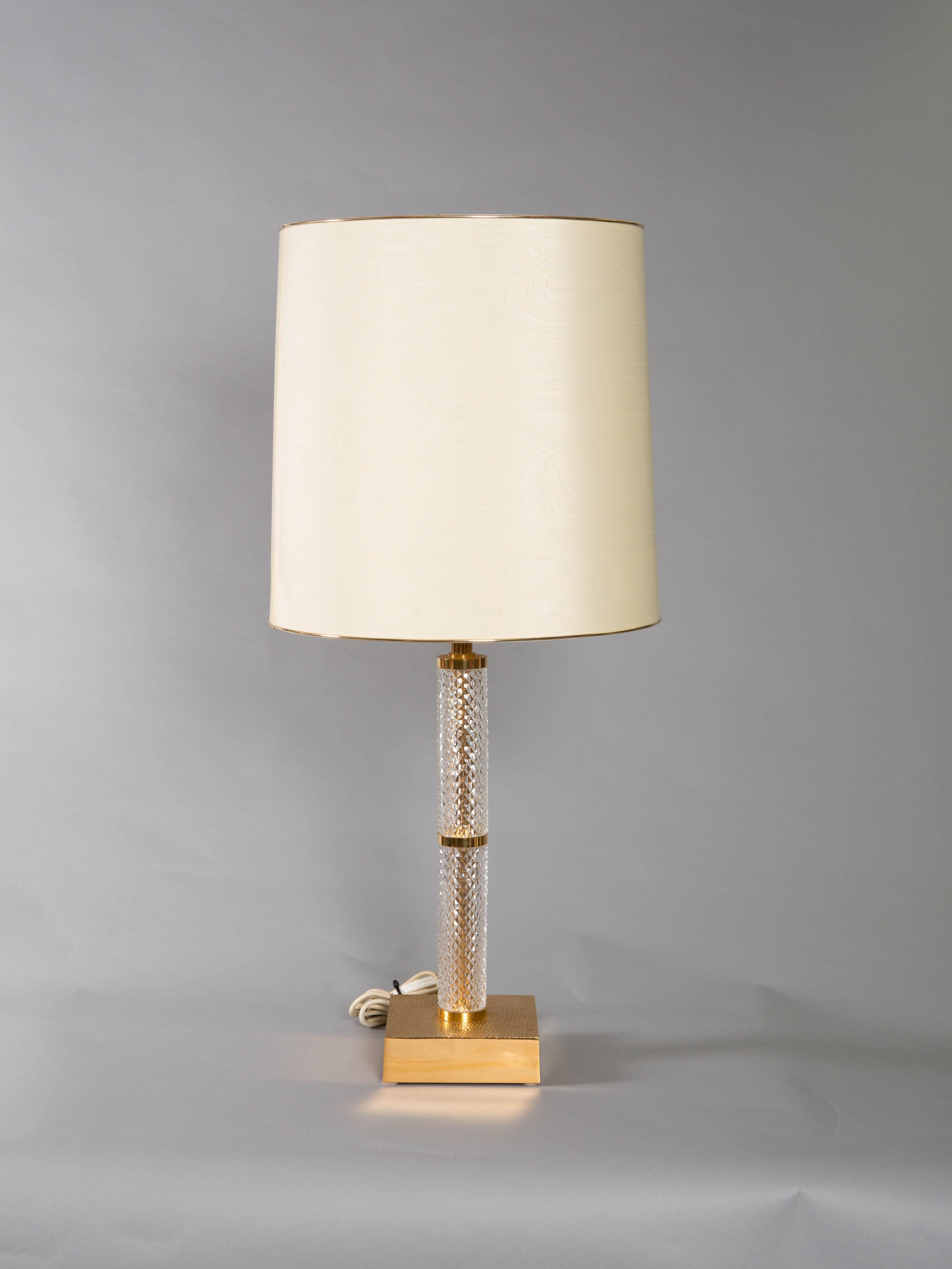 Pair of French cut crystal table lamps with dimpled gold sculptural base and original shades. .