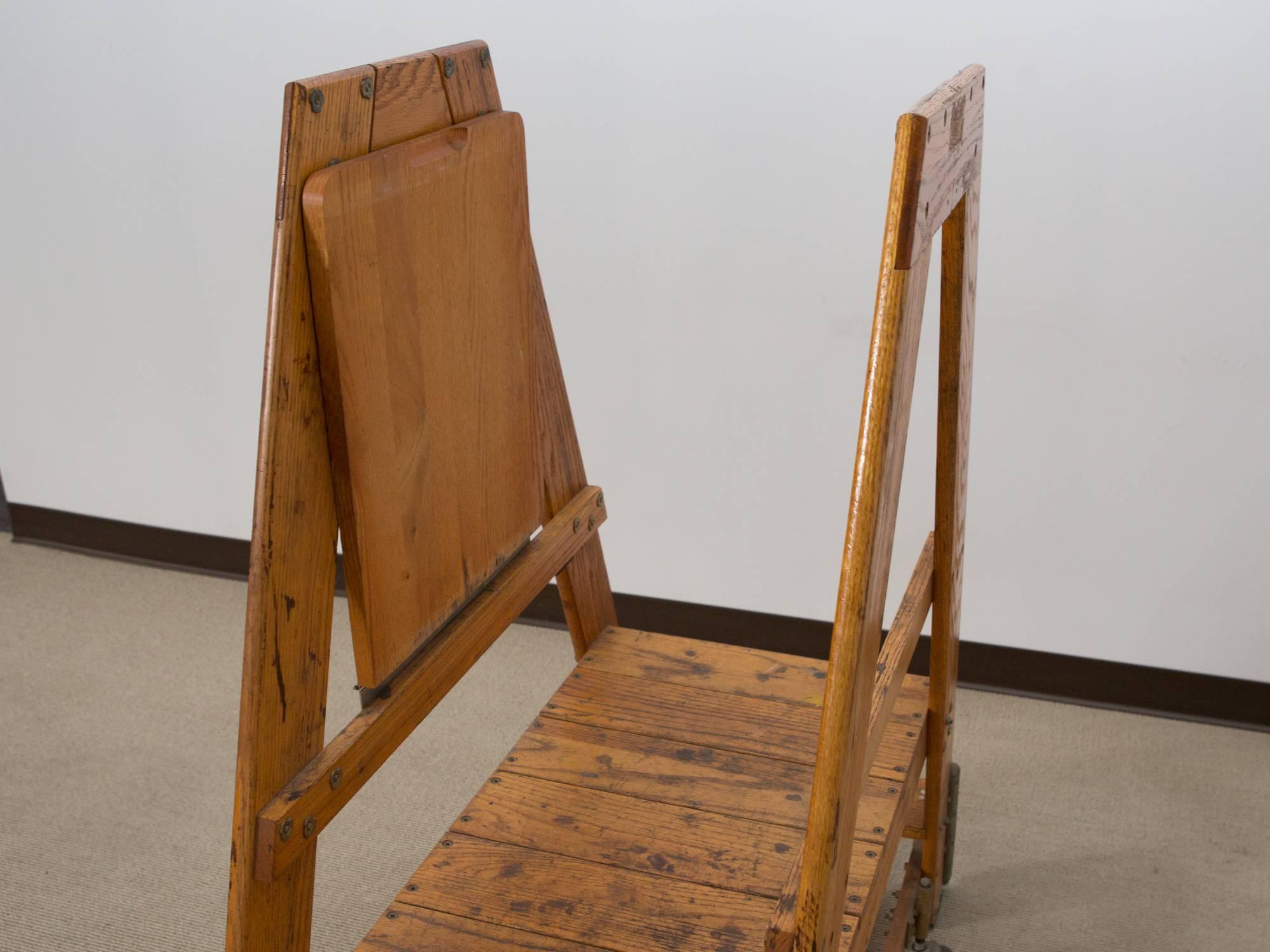 Mid-20th century, American Industrial oak rolling step ladder stamped 