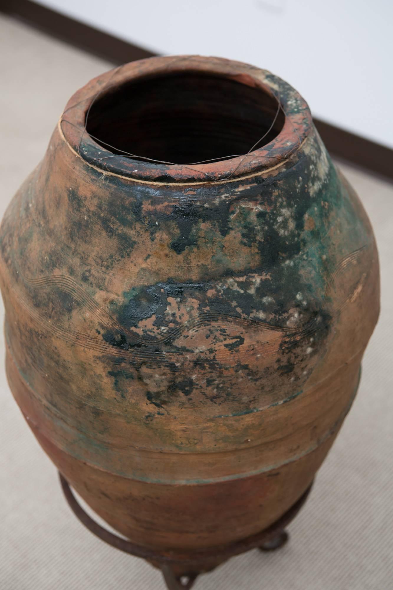 large glass vase with metal stand