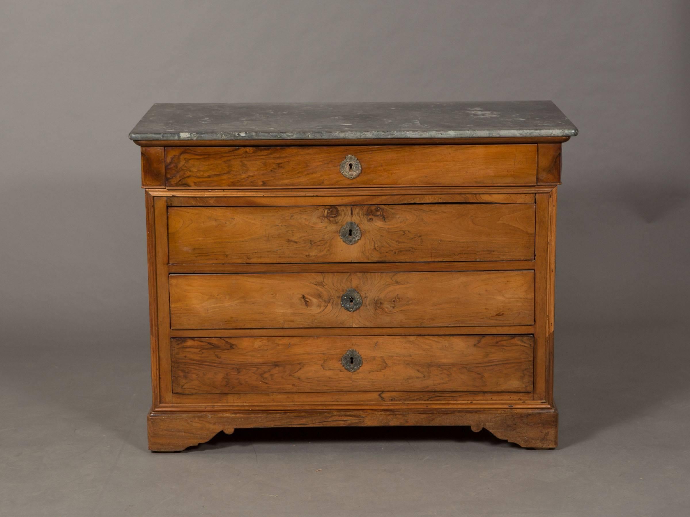 Charles X four-drawer elm commode with keys marble top and trim detail.