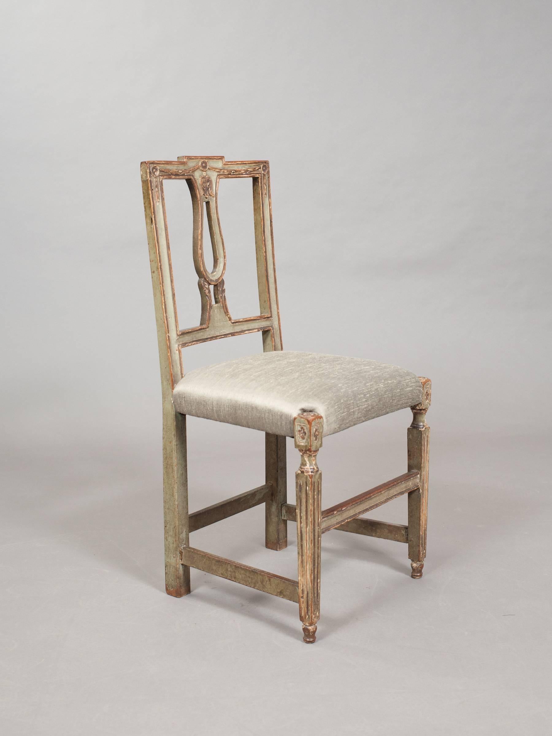 Pair of early 19th Century sage green painted and parcel gilt side chairs upholstered in sage green ribbed silk. 
15.75