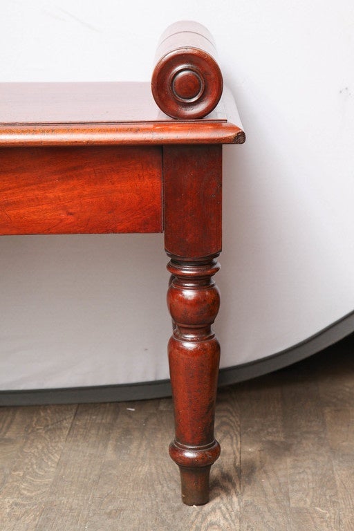 A bench made of a fine mahogany 

Handpicked by buyers at Ann-Morris, Inc.