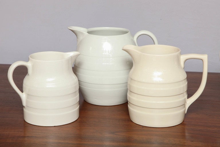 A collection of antique creamware jugs of unique style and shape.

Would make for great decor in any kitchen.

Handpicked by buyers at Ann-Morris, Inc.

The sizes vary slightly for each jug.
Please specify which jug you are interested