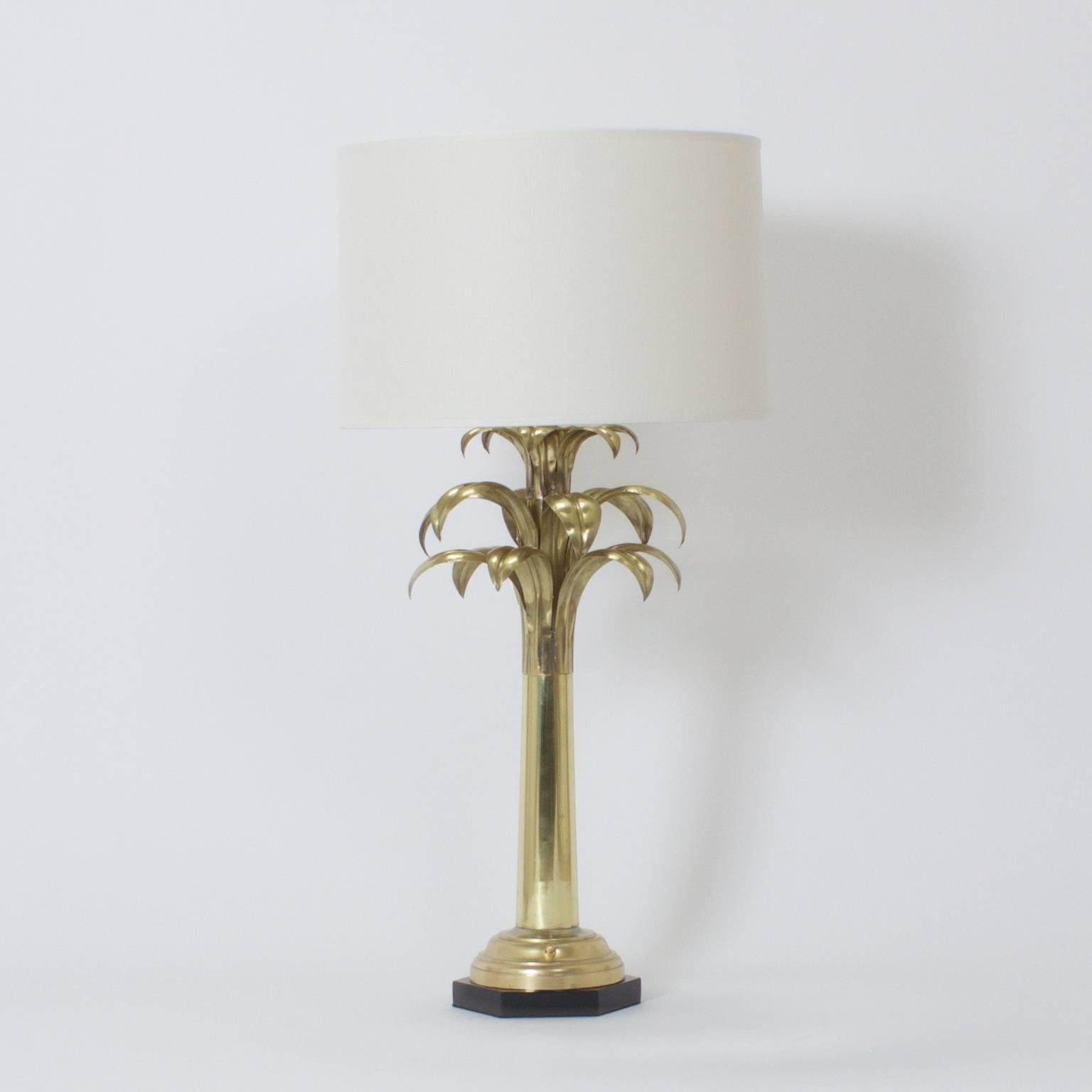 Pair of Mid-Century, sculptural palm tree table lamps crafted in brass with a sleek, tight design then set on ebonized hexagonal plinths. Possibly by Chapman. Newly polished and wired.