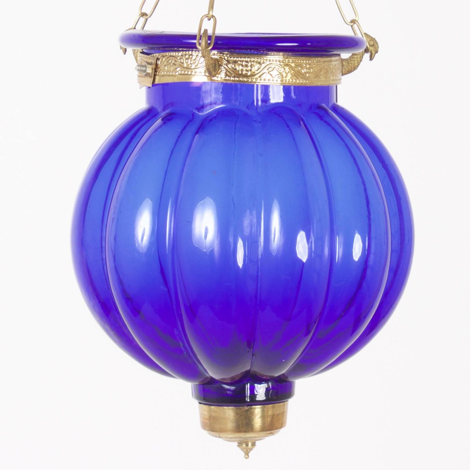 Anglo-Indian bell jar light fixture composed of luxurious cobalt blue pleated glass and finely tooled brass hardware. Contact for wiring.
 