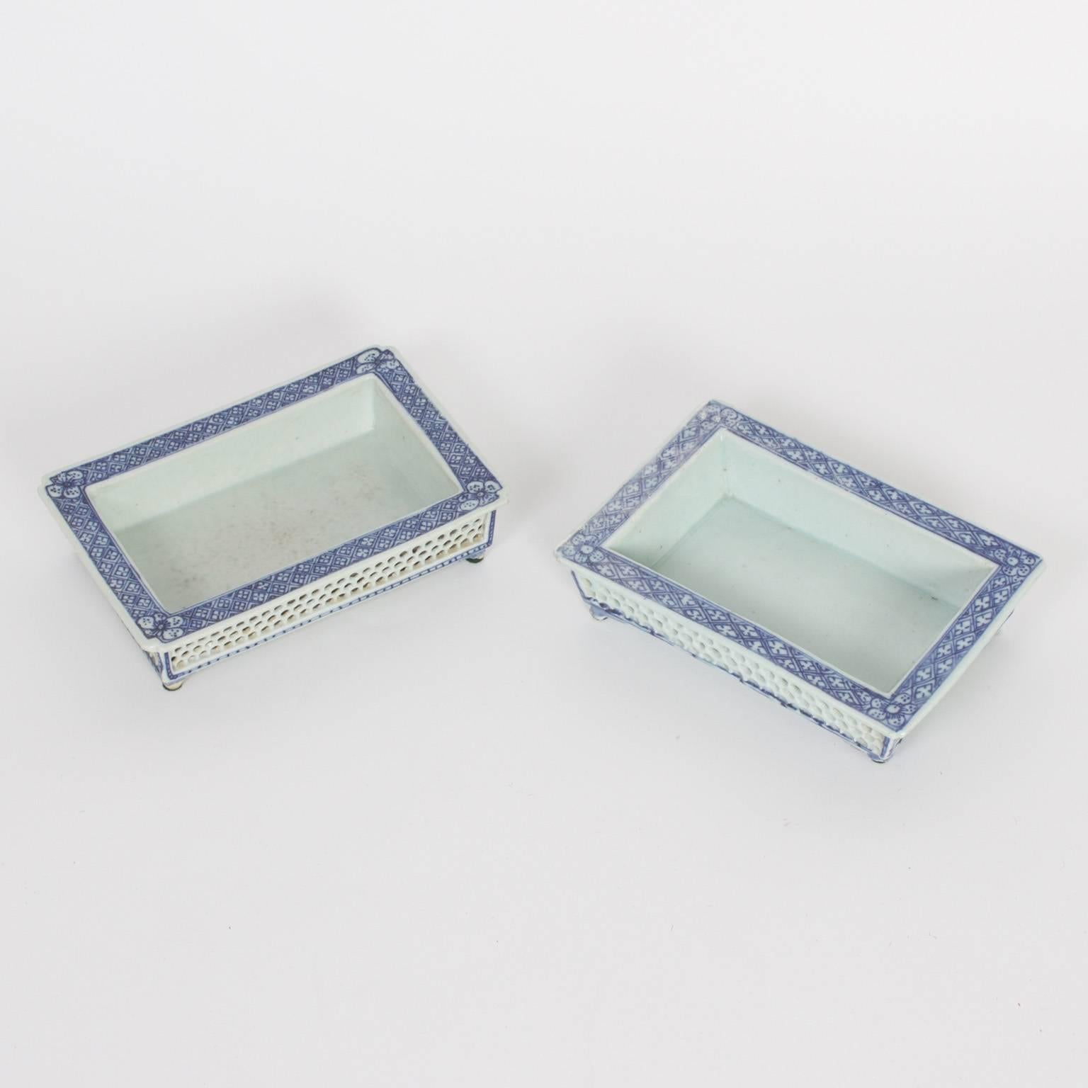 Two Chinese export porcelain blue and white narcissus trays with their distinctive form, floral decorations, reticulated sides and petite feet. Priced individually.
 