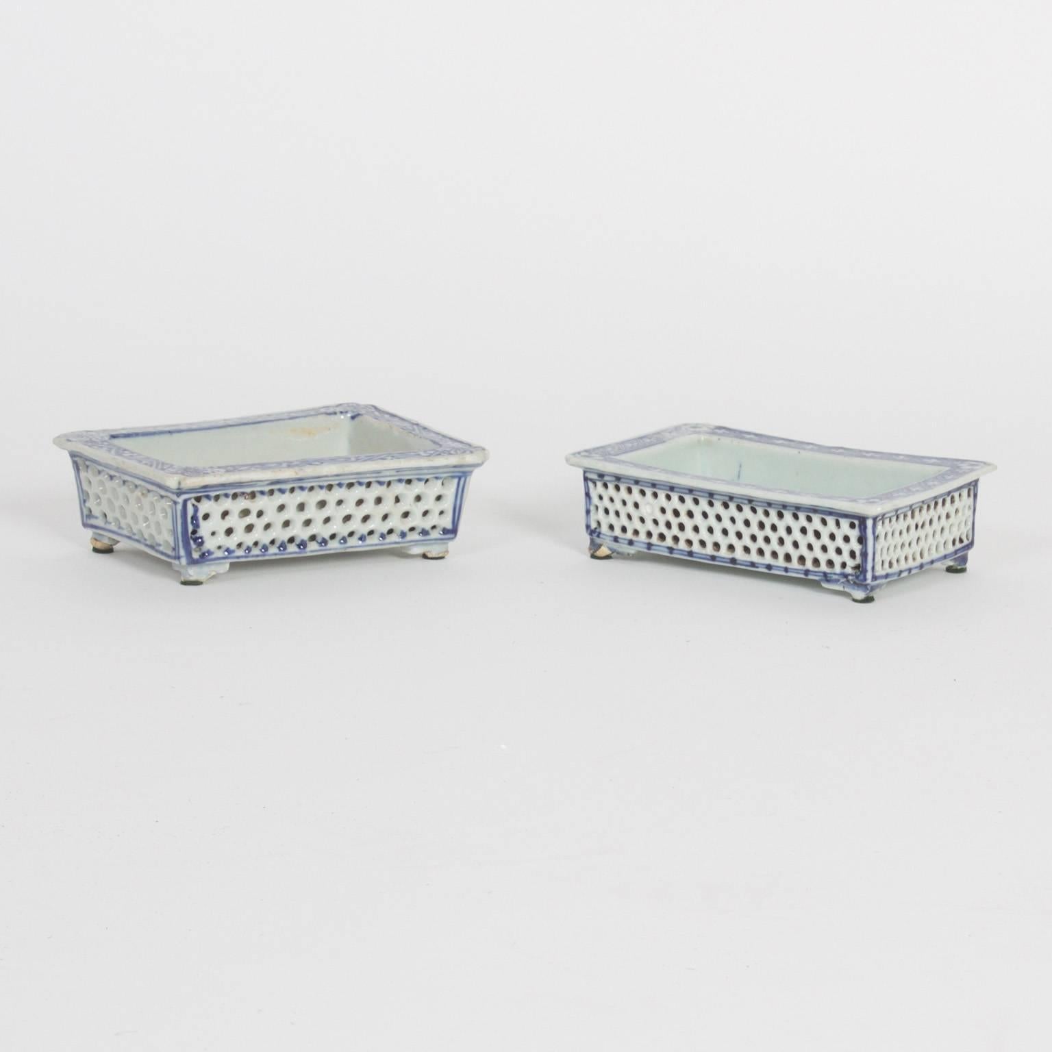 Three Chinese porcelain blue and white narcissus trays with their traditional form, floral decorations, reticulated sides and petite feet. Also available individually. 

From left to right:

H: 2 W: 7 D: 4.5 $895.00.

H: 2.5 W: 9.5 D: 6.5