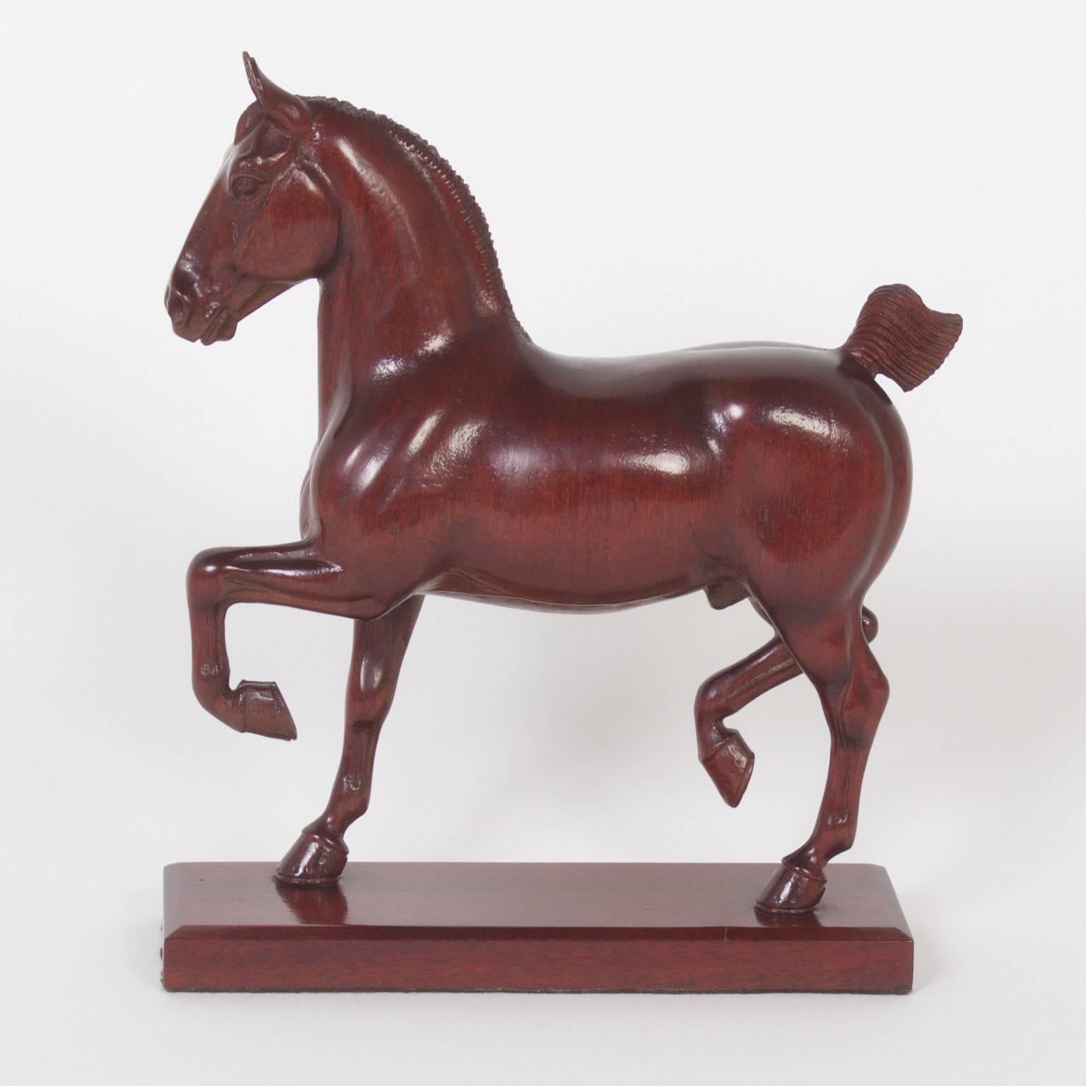 Inspired mahogany show horse models captured in mid strut, carefully carved with loving attention by Peter Giba. Priced individually.
 3709 Sold.