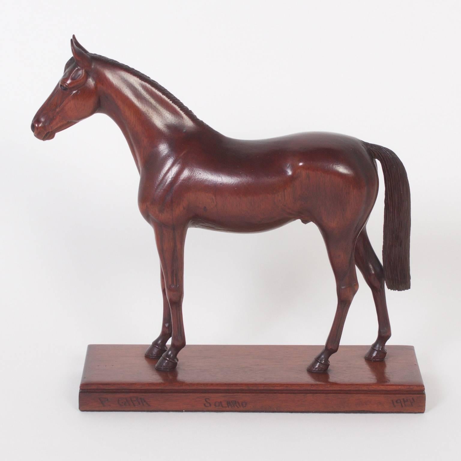 Here are three brilliant, carved mahogany horse sculptures that display an uncanny talent for capturing the spirit of the animals. Carved with rare attention and expertise. Two models signed, titled, and dated. All three carved by Peter Giba. Priced