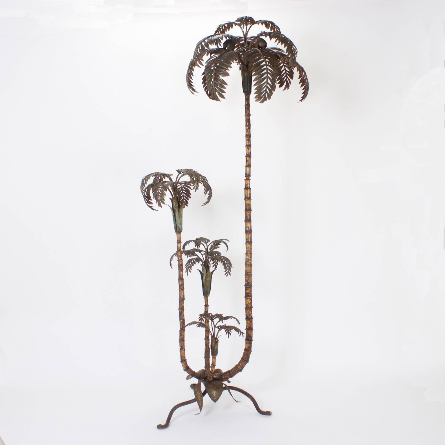 Tole palm tree sculpture with four separate palm trees at assorted stages of development. Original paint now muted and oxidized. All mounted on a handwrought organic shaped base.

 