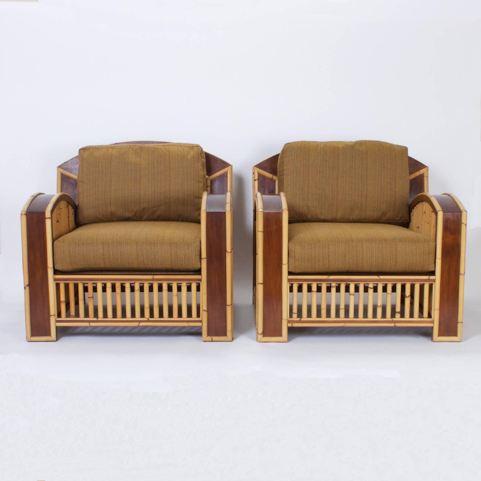 Impressive pair of Art Deco inspired rattan club chairs with a streamlined form. Crafted with bamboo and mahogany giving these chairs a harmonious two-tone, organic palette that suits the tropical vibe.

   